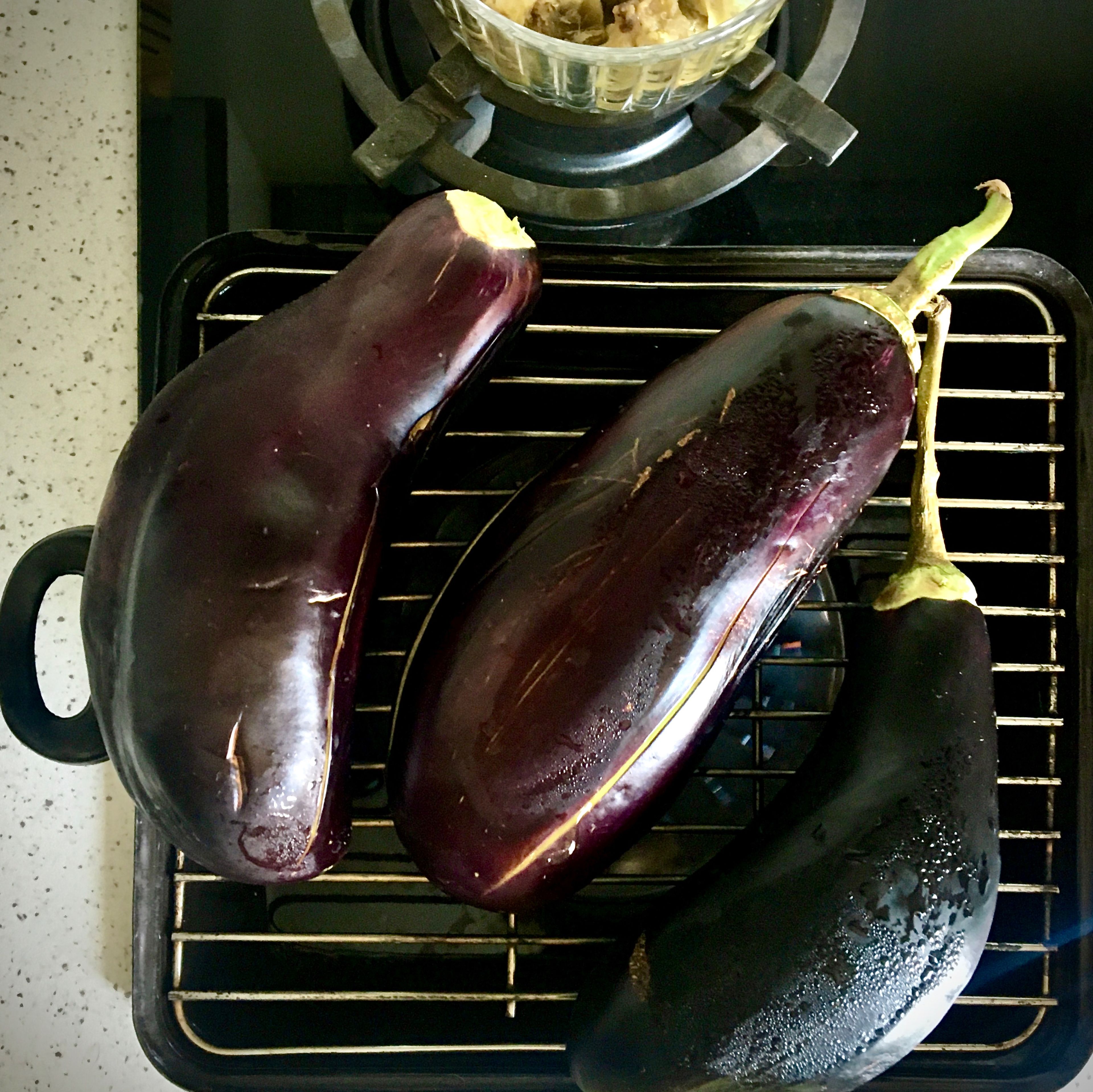 My usual way for burning/smoking things like eggplants is using the griddled pot over gas hobs with medium-high flames. Cutting some scores over the eggplants’ flesh helps their steam comes out and prevent them from bursting.
