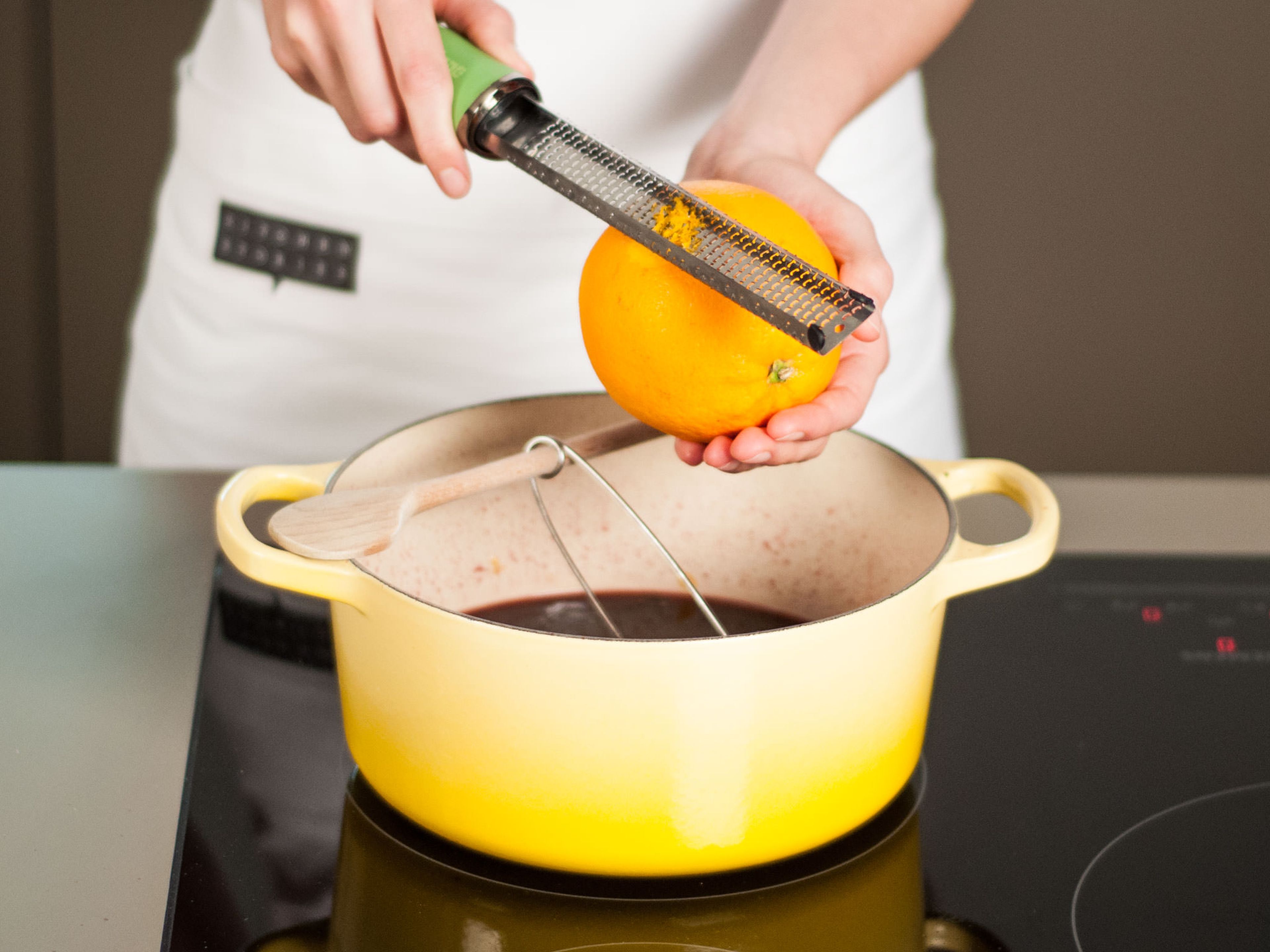Preheat oven to 180°C (350°F). Zest lemon and orange into saucepan.