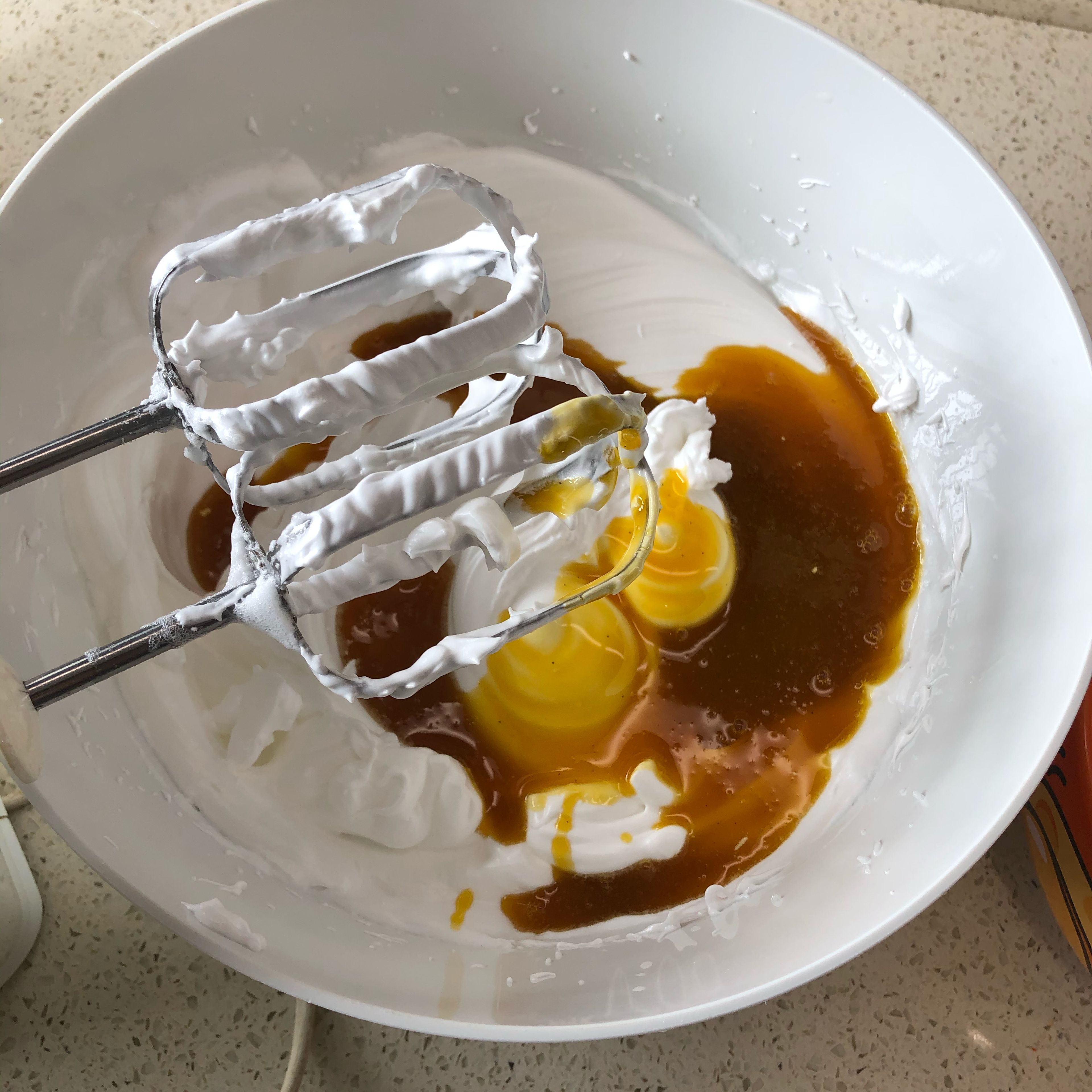 Add in egg yolk mixture and slowly beat till blend