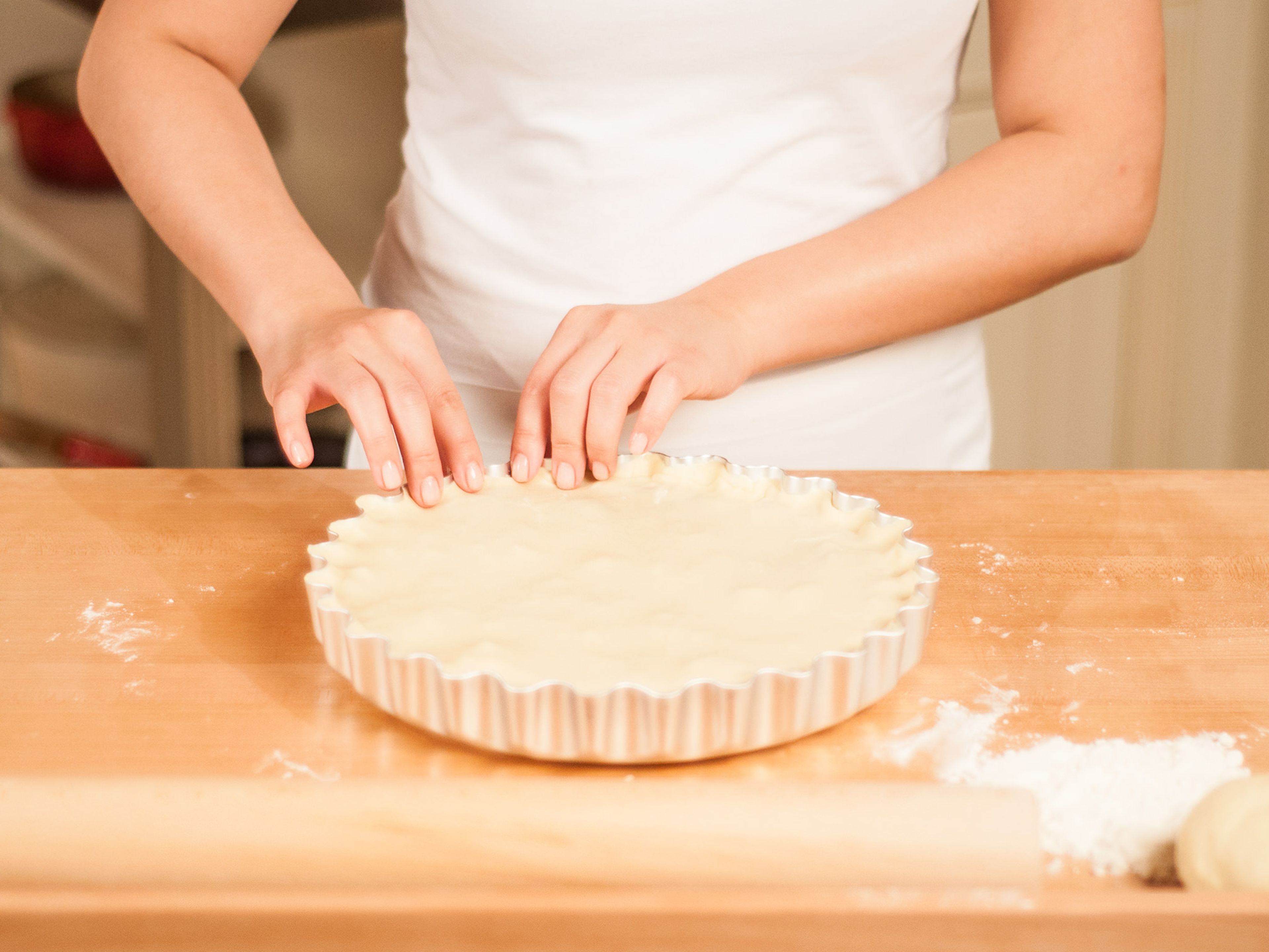 Cover the pie with the prepared top crust. Trim the excess leaving an overhang of approx. 1cm. Crimp overhang to seal the pie.