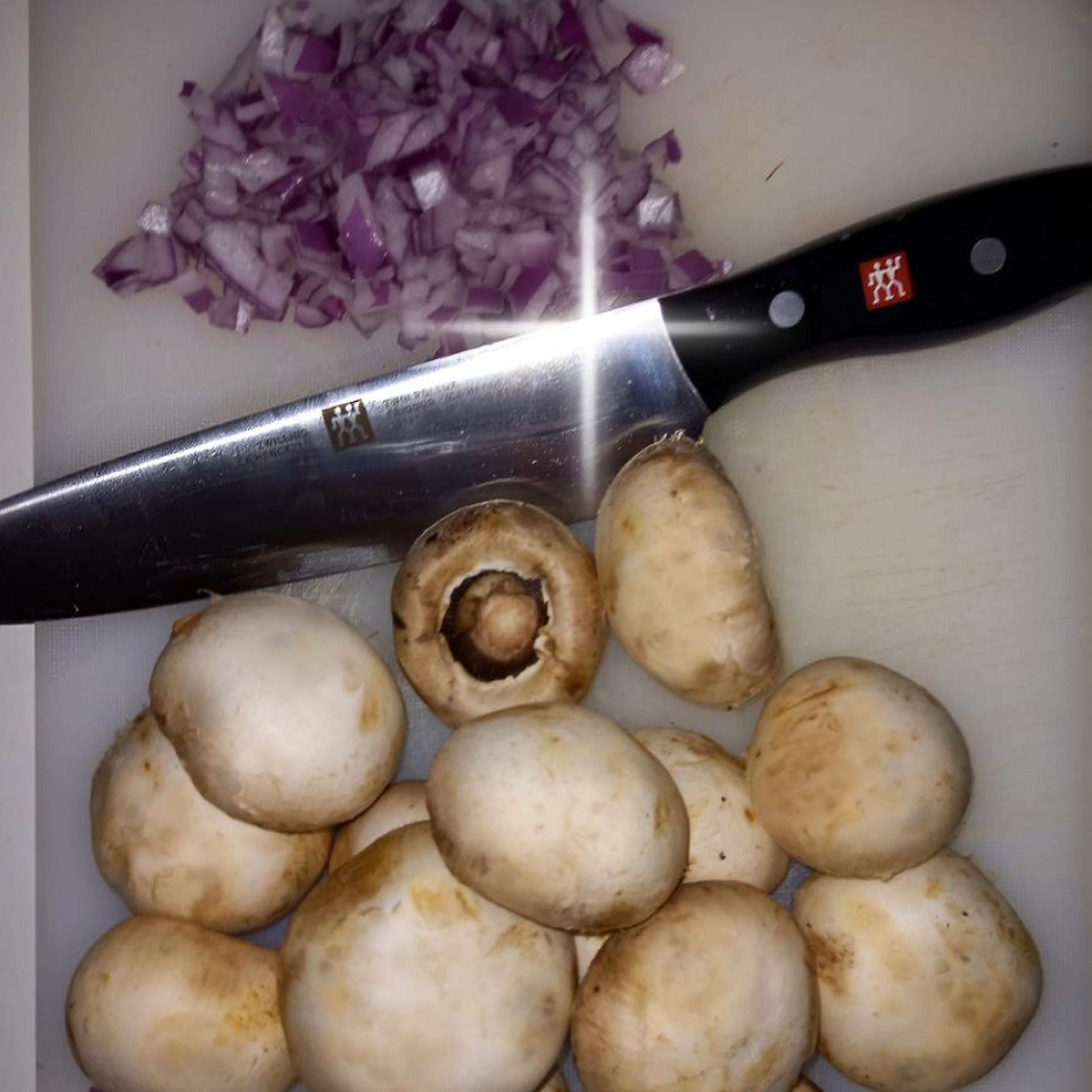 Cut the fresh mushrooms into pieces. Dice the shallot. Place the dried mushrooms in warm water and let soak.