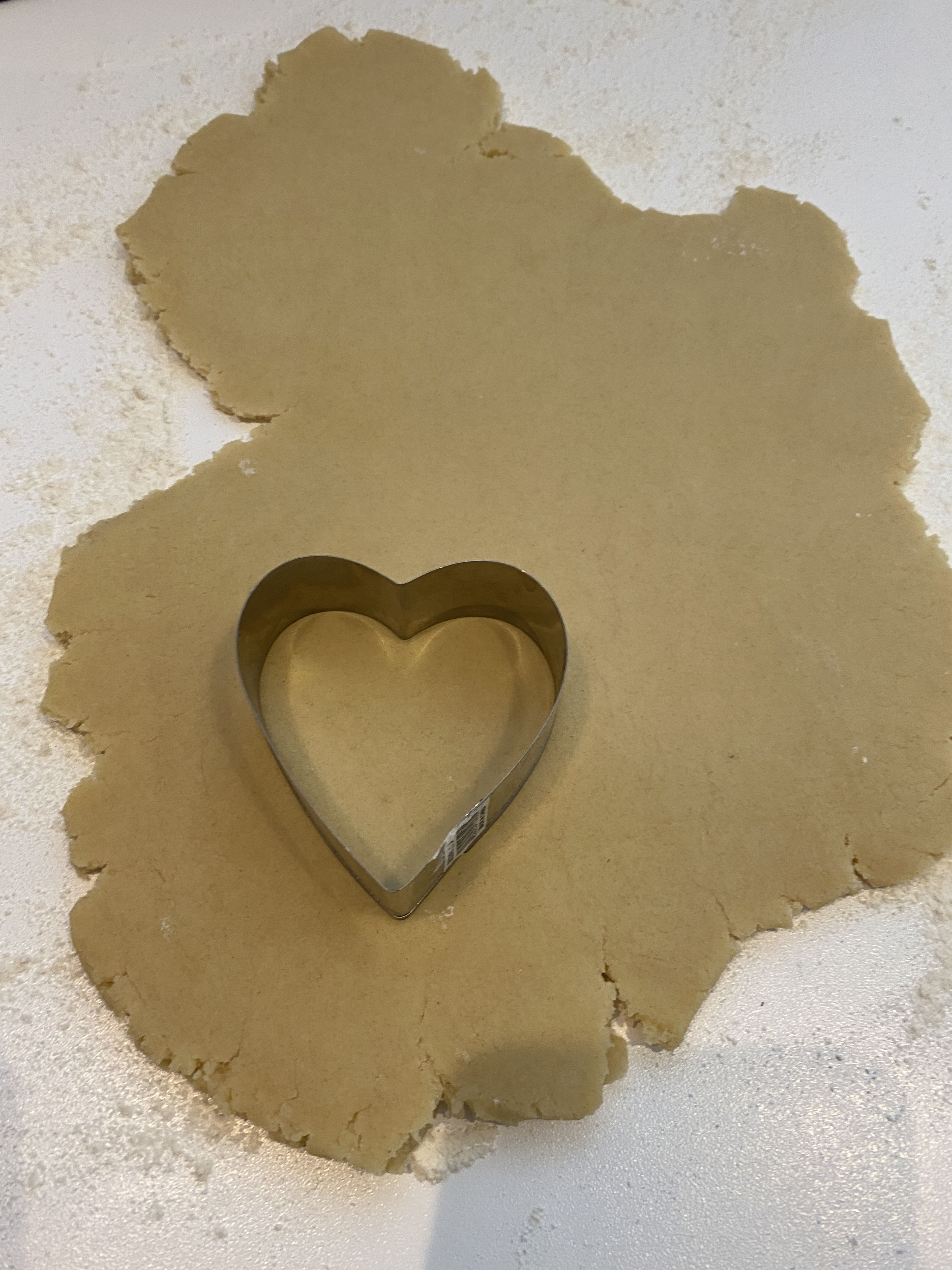 On a lightly floured surface, roll out the dough to a thickness of 2.5cm/1in. Stamp out about as many hearts shaped biscuit cutter (or any other shape!) as you can. 