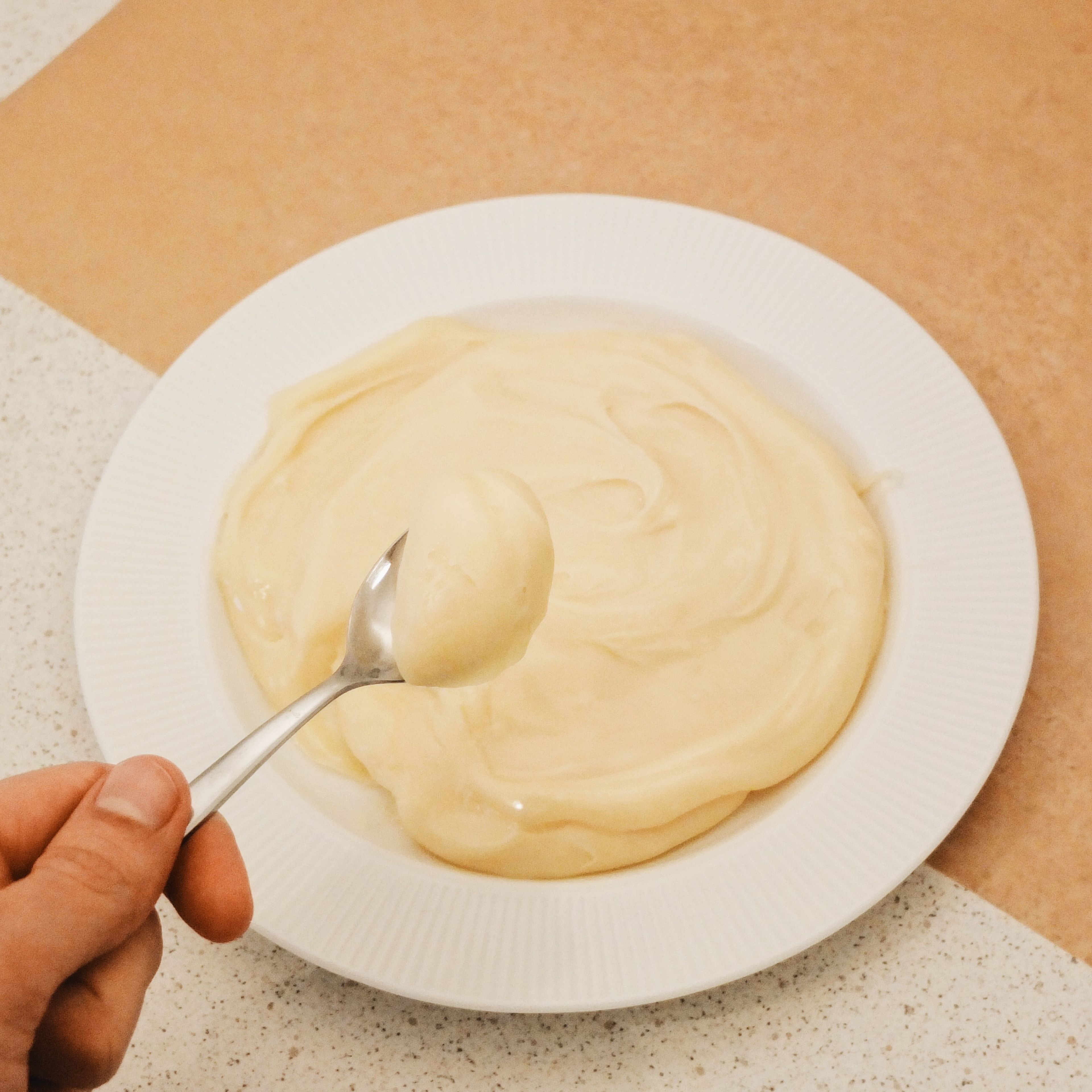 Spread butter on your hands and with a teaspoon scoop some of the mixture. Put it on your hand and roll it to form a small ball.