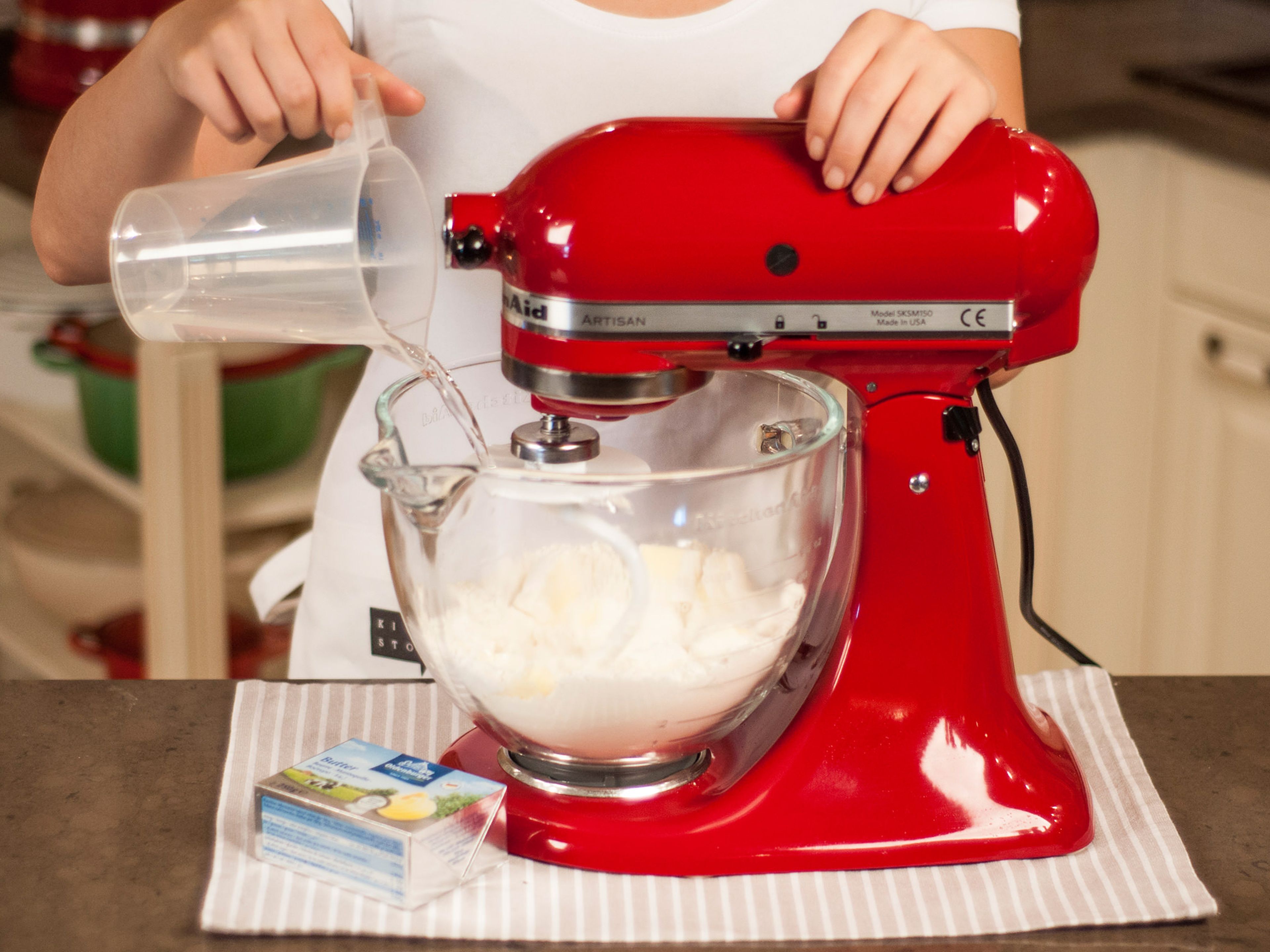 For the base, use a standing mixer or a hand mixer with dough hooks to mix flour, cold butter, and some of the salt. Beat in cold water. Then knead dough by hand until smooth.