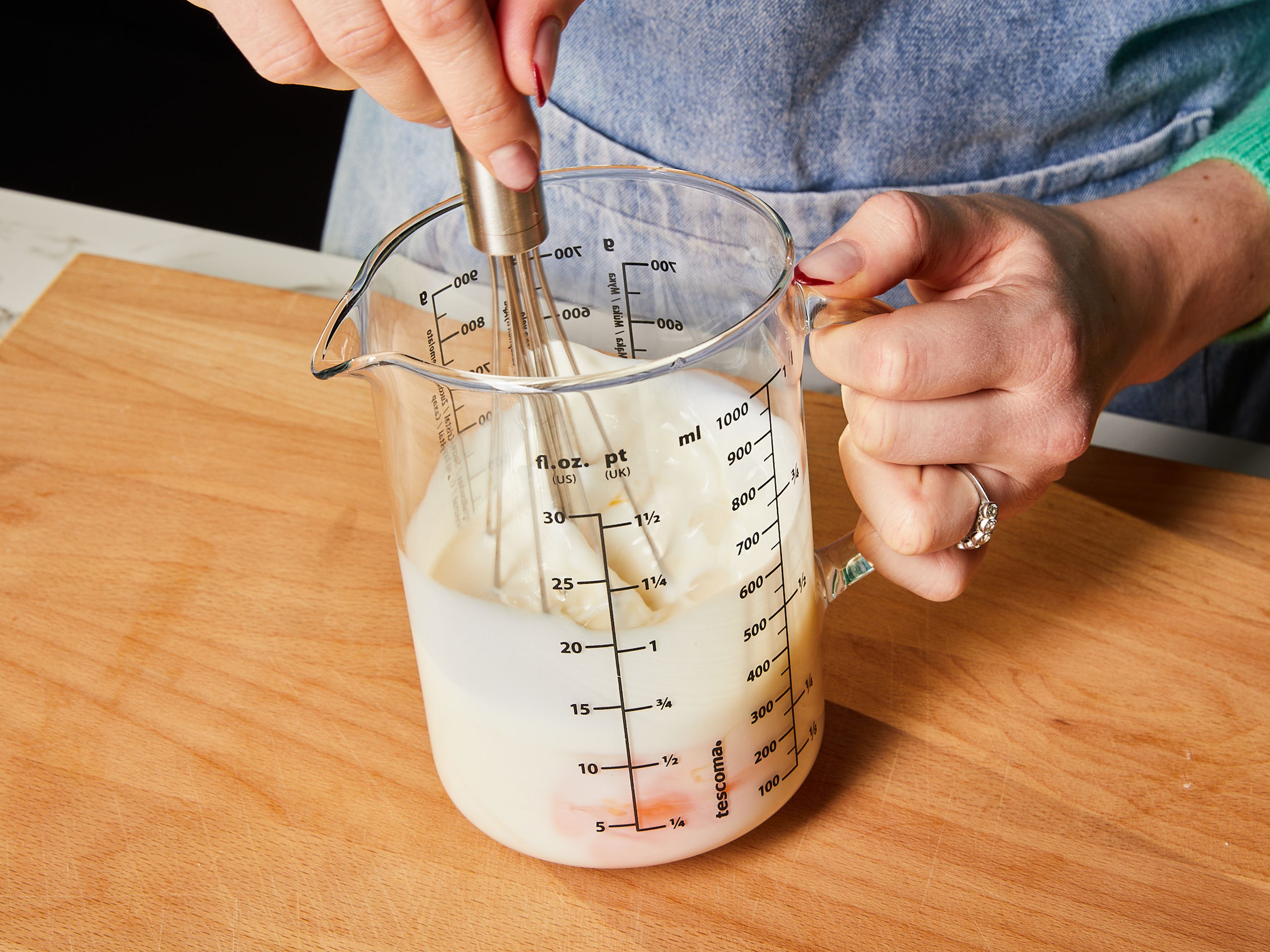 Whisk the eggs and milk in a small measuring cup. Then stir in the melted butter.