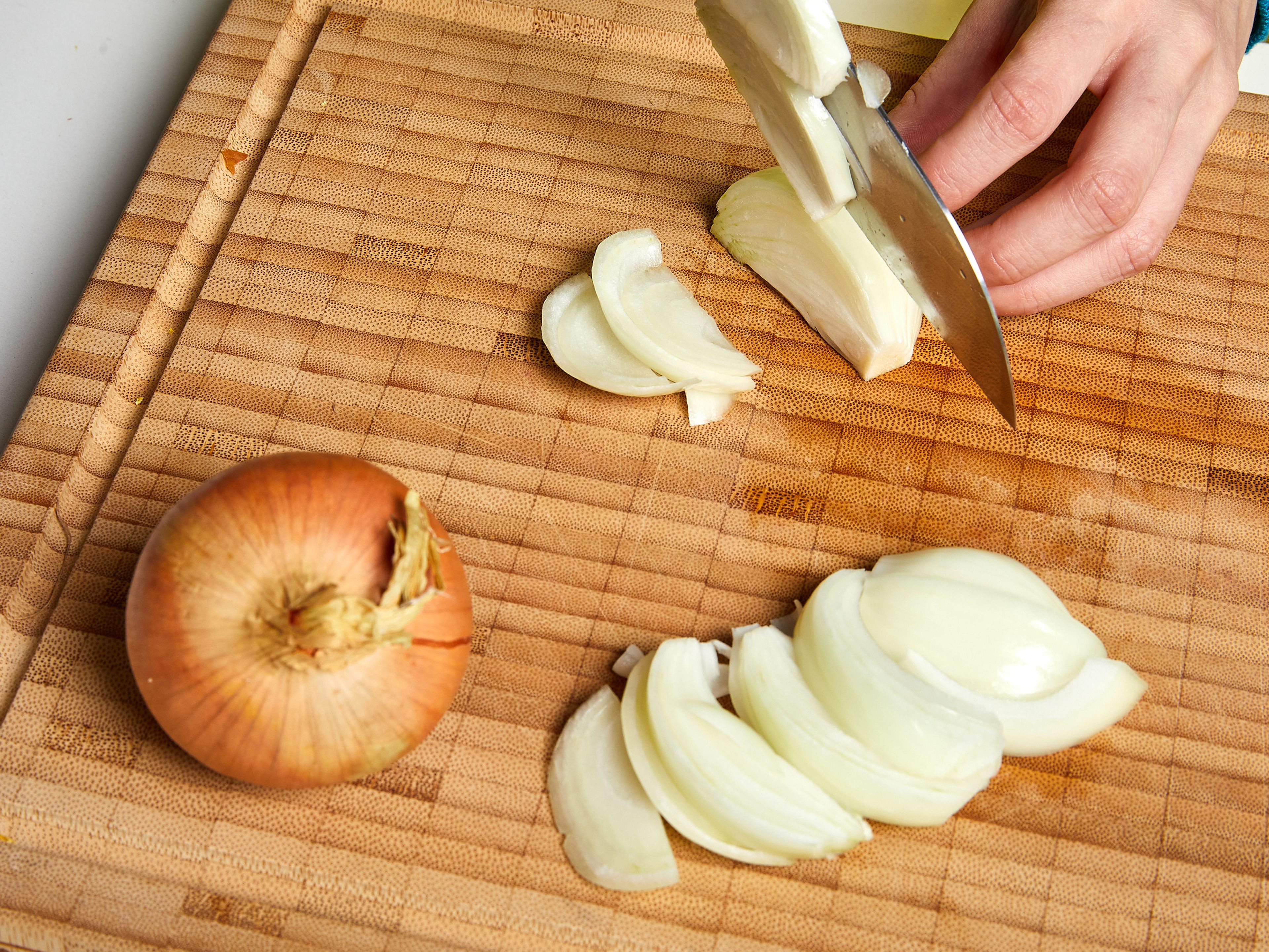Finely dice one-third of the onions and cut the remaining onions into wedges. Heat and melt plant-based butter and olive oil in a large pot. Add onion wedges and cook over medium heat until caramelized, approx. 15 min, stirring occasionally. Be careful not to burn them.