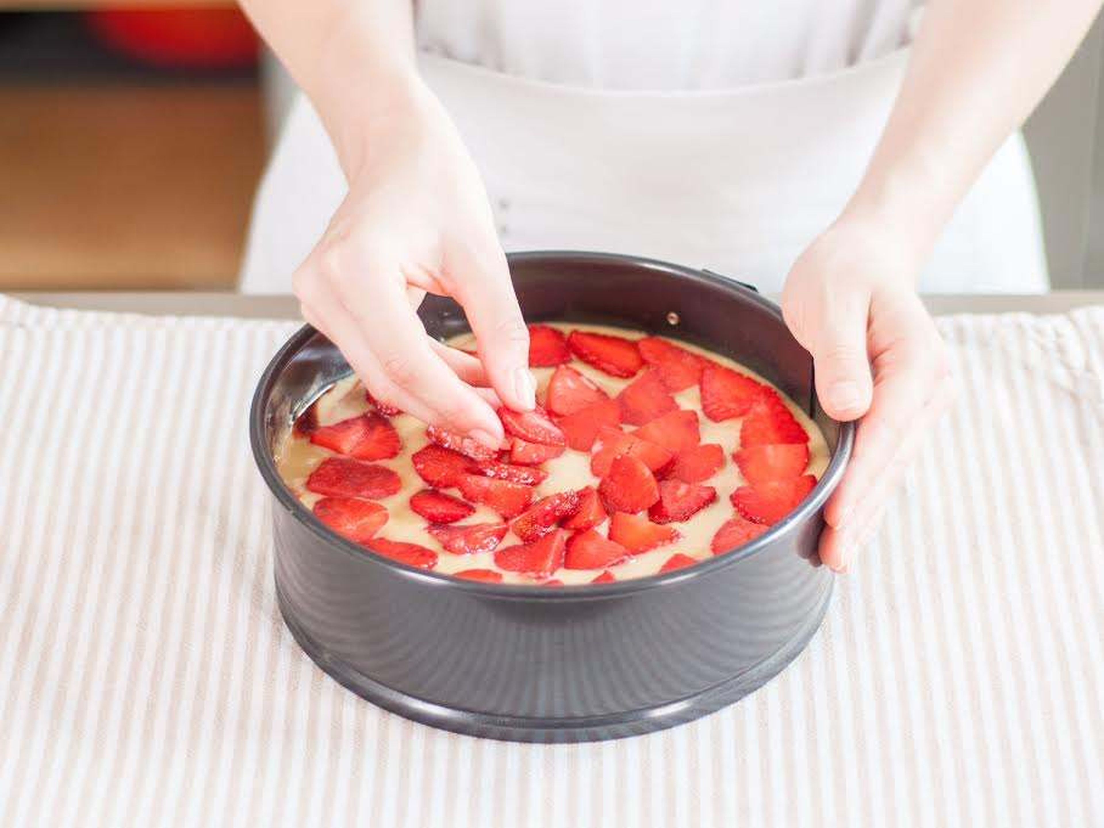 Top with second half of batter, then arrange sliced strawberries on top in concentric circles. Bake for approx. 45 min. – 1 hour at 175°C/350°F, or until a toothpick inserted into center of cake comes out clean or with a few moist crumbs.