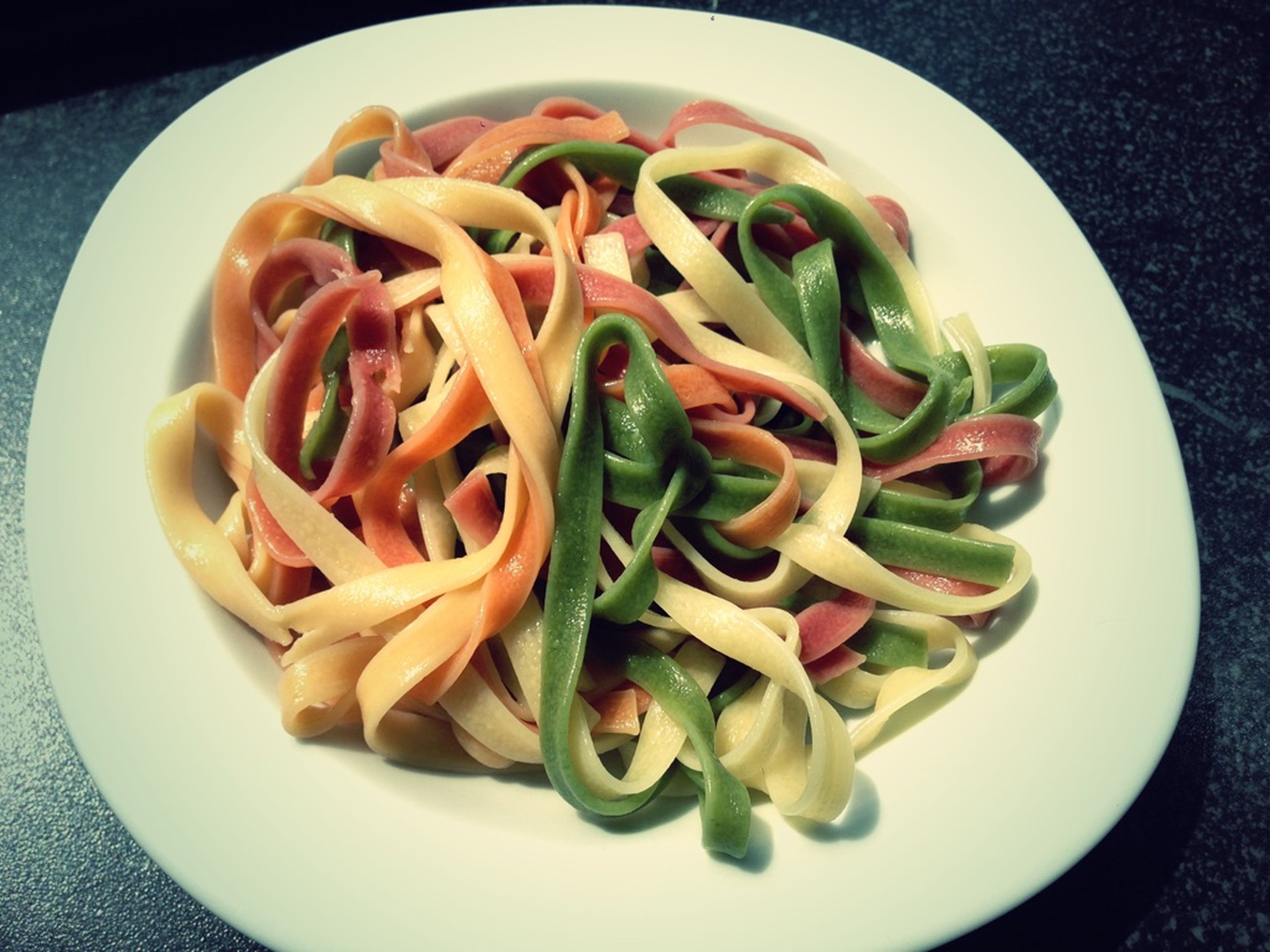 Strain tagliatelle and transfer to plates. Serve with tomato-smoked salmon cream sauce and garnish with basil. Enjoy!