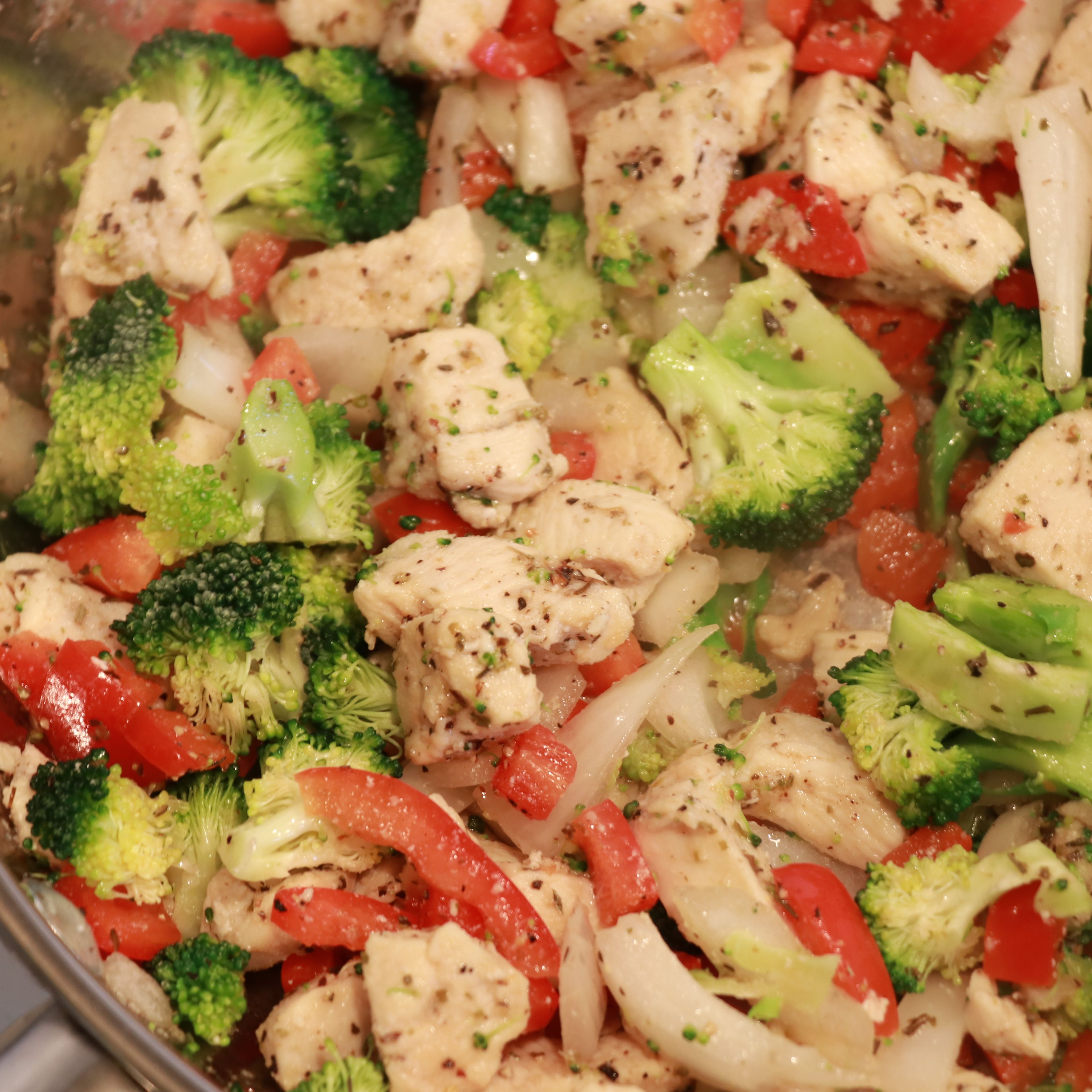 Add in red pepper, broccoli and onion to the pan with the chicken and cook another 3-4 minutes.