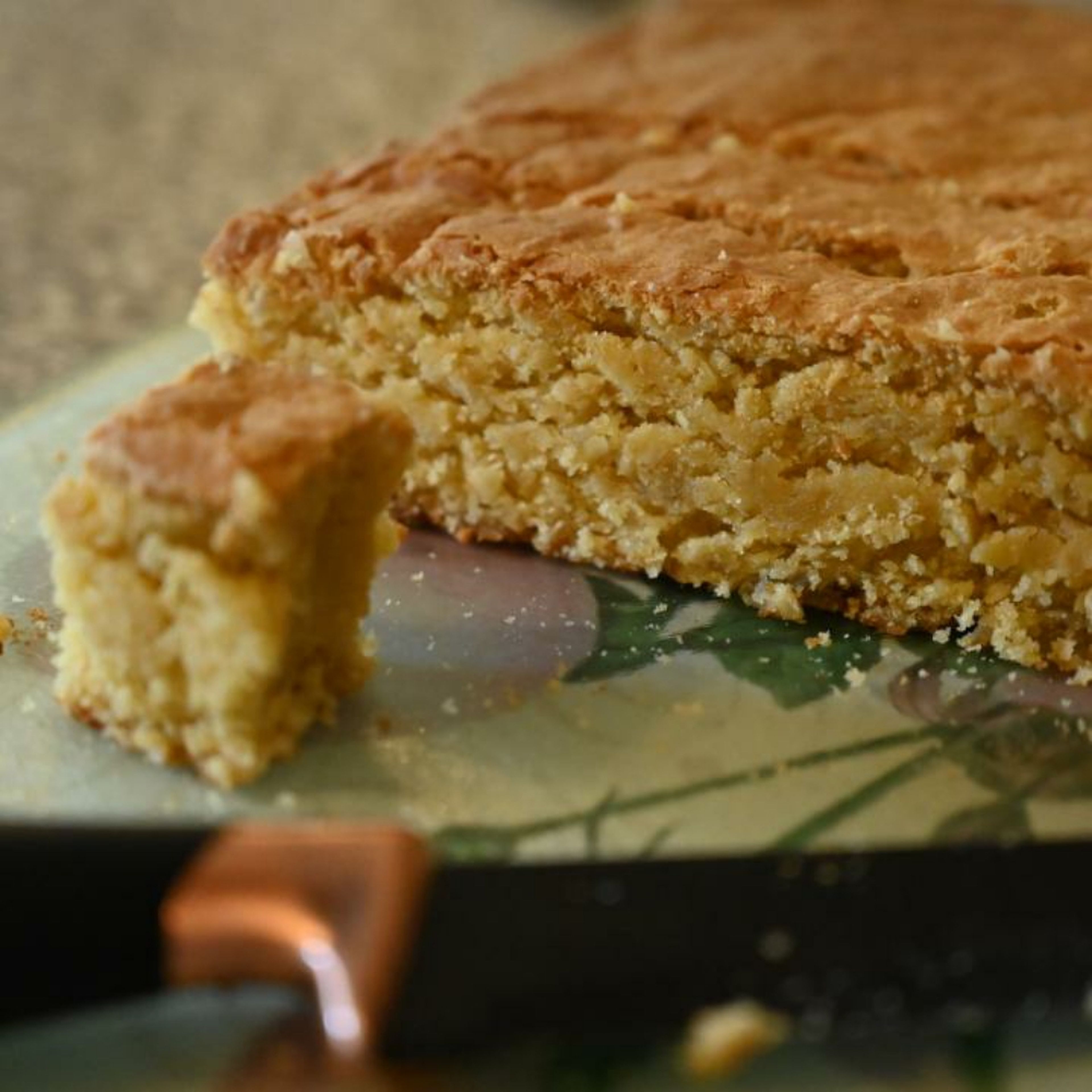 Remove the cake from the baking tray and place on a clean board and cut the cake into desired sizes, 