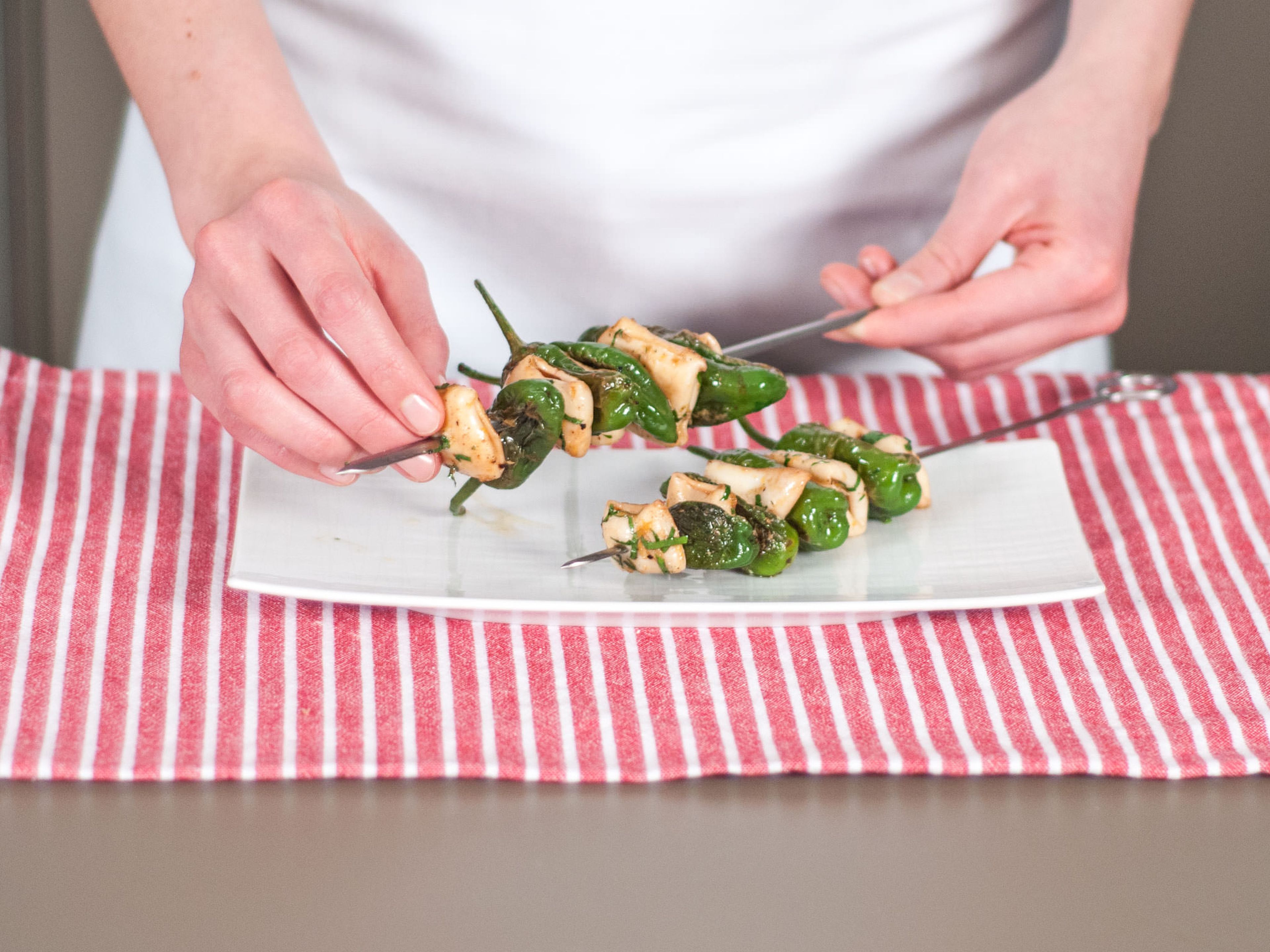 Assemble on skewers, alternating peppers with calamari for a nice presentation. Enjoy with guacamole and aioli!