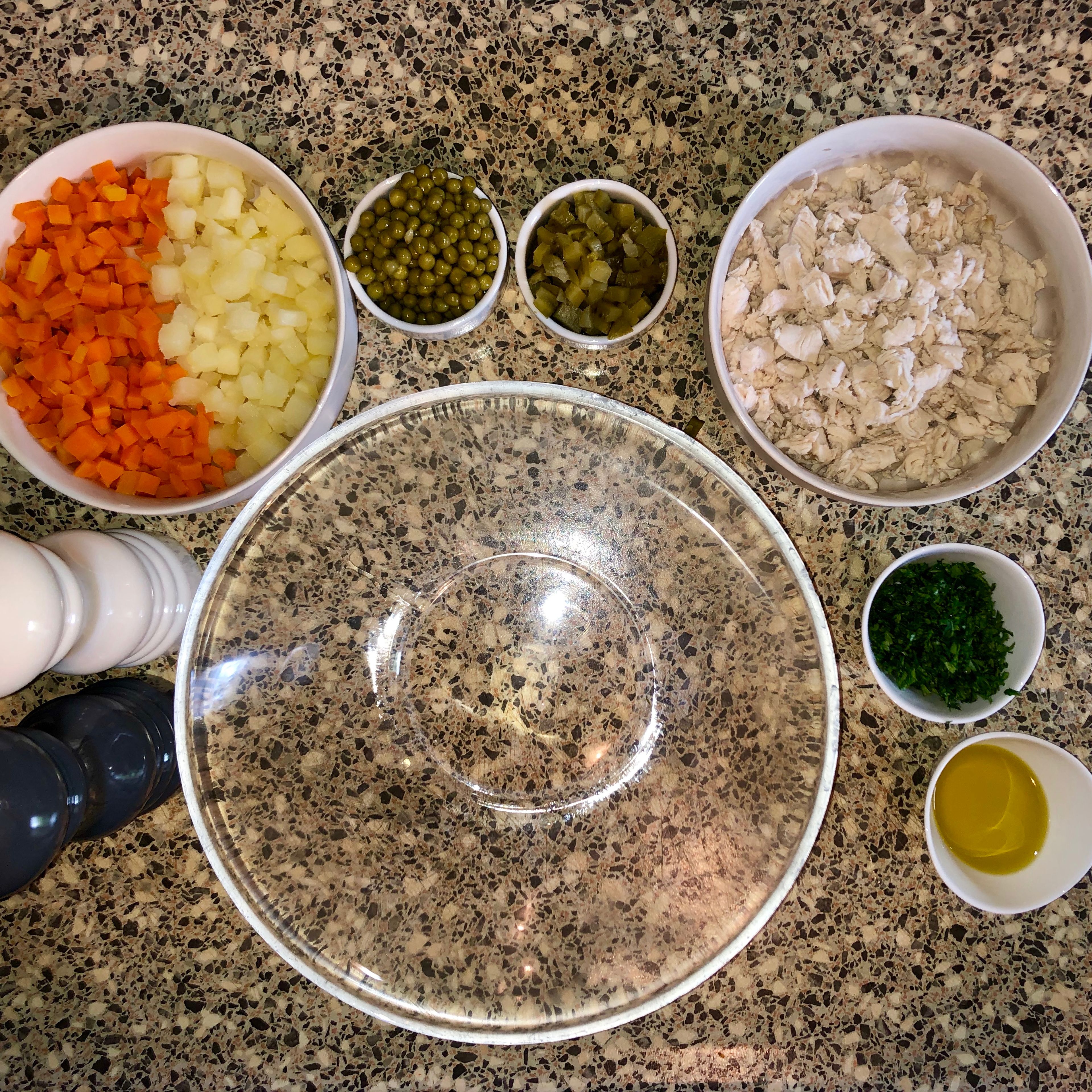 Combine all the ingredients in a mixing bowl and mix well. ( already cut chicken breast, carrots, potatoes, pickles, sweet peas, chopped parsley, olive oil, salt and pepper.