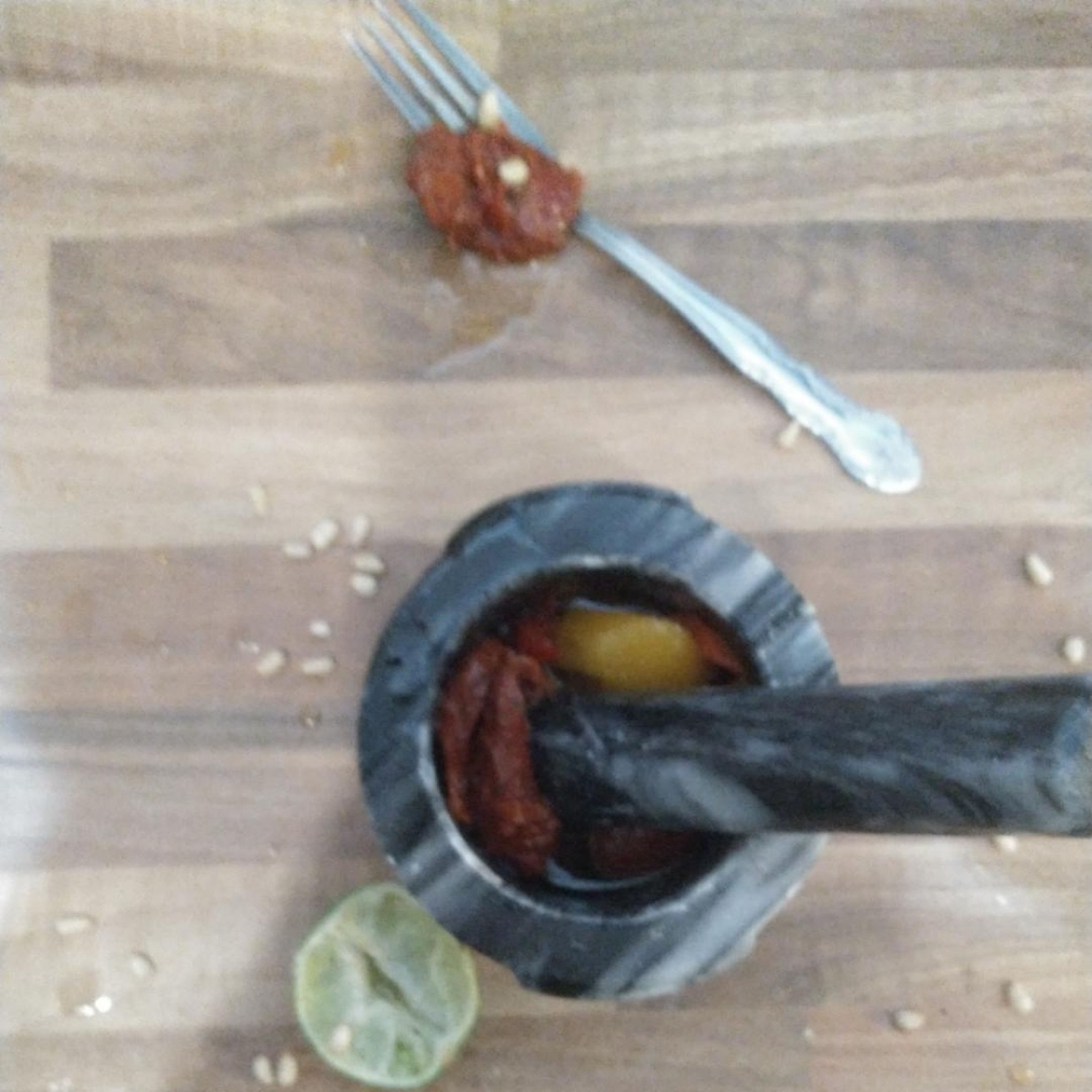 In a pestle and mortar, bash/grind the roasted red peppers and sun-dried tomatoes along with 2tbsp or so of the oil they come in (oil from either the peppers or tomatoes, or both, is fine). Squeeze in the lime juice and mix.