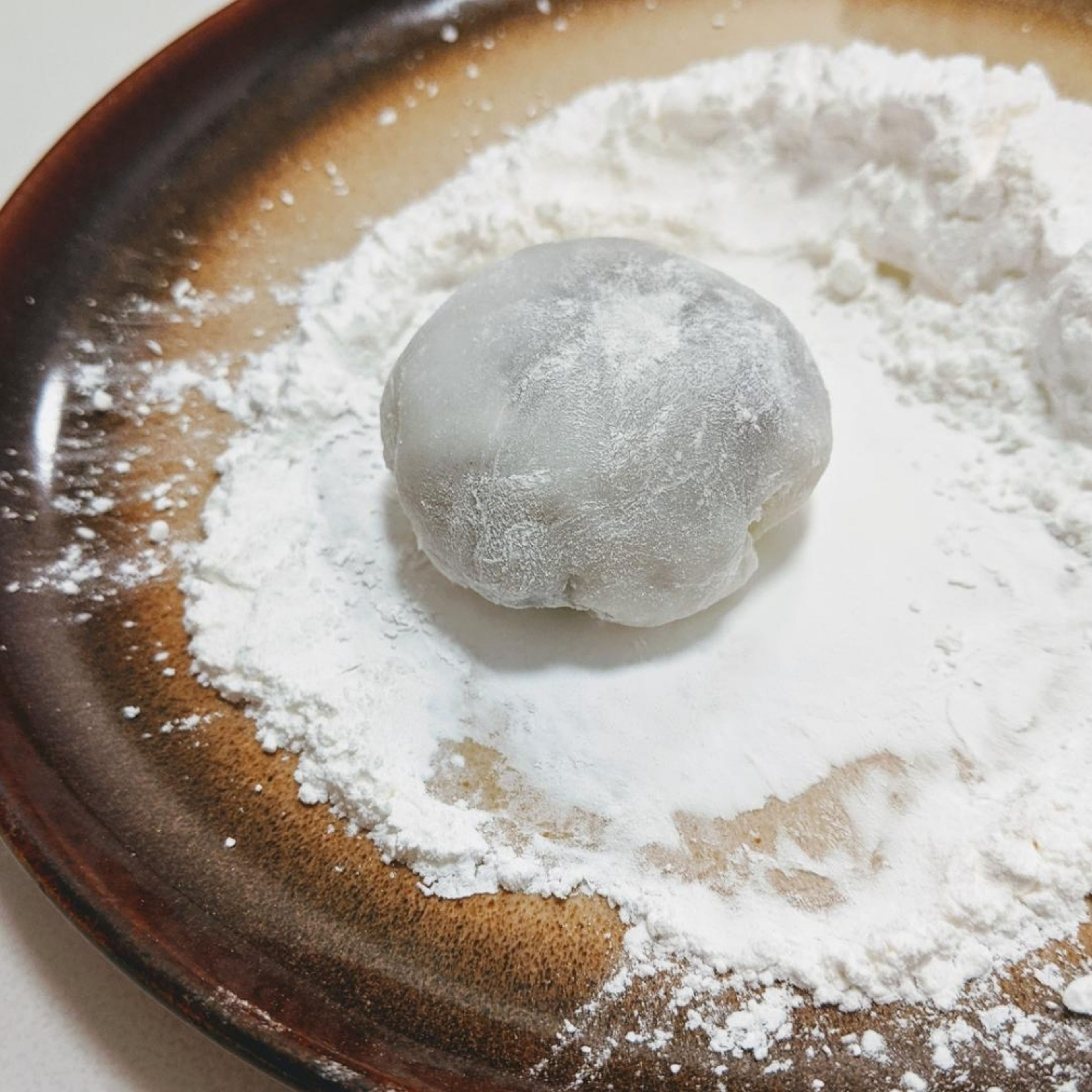 Make it round with both hands if necessary, here you go, the first mochi!