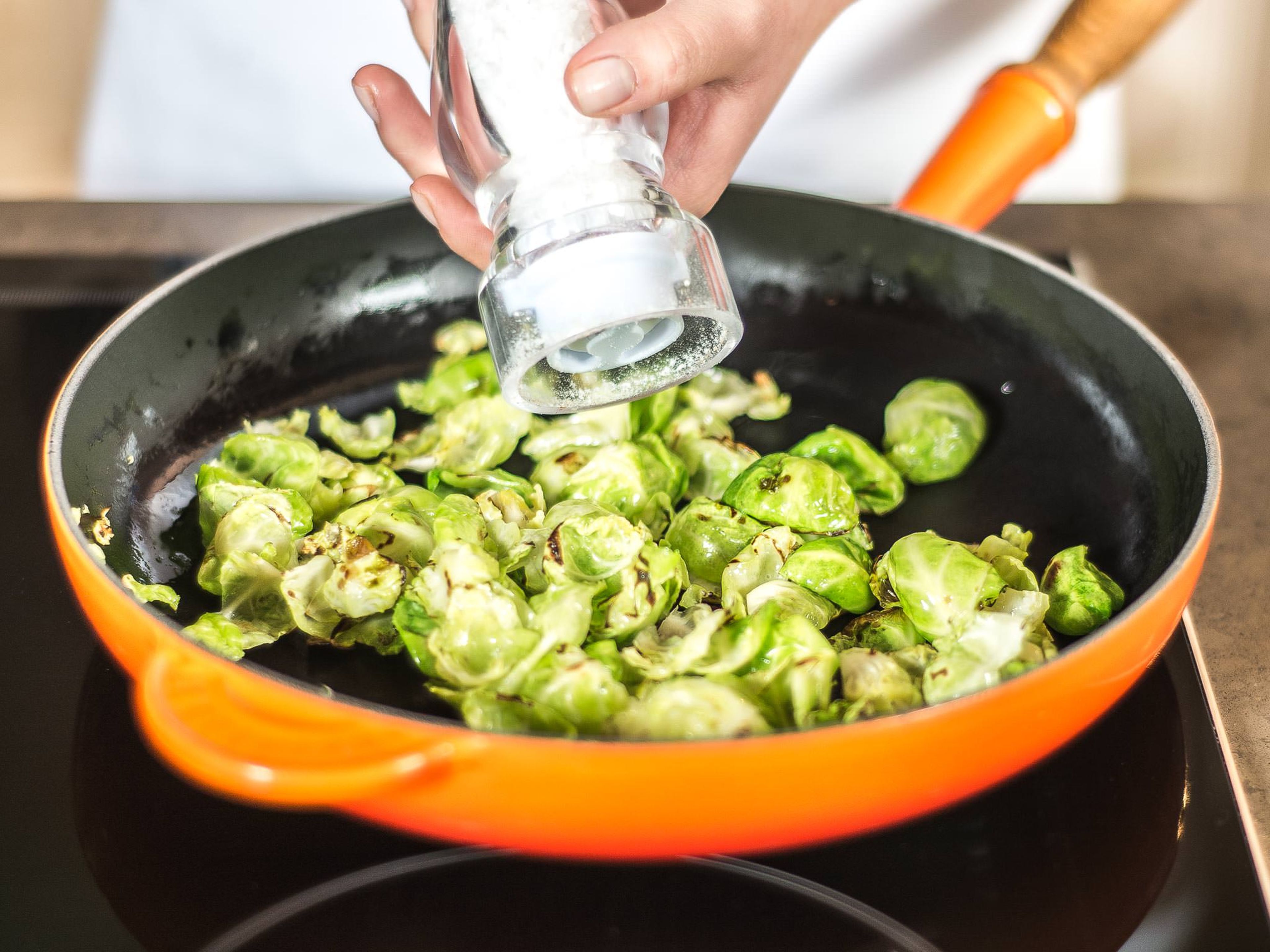 Sear the Brussels sprouts leaves in a hot frying pan with some vegetable oil; season with salt and pepper and a pinch of nutmeg.
