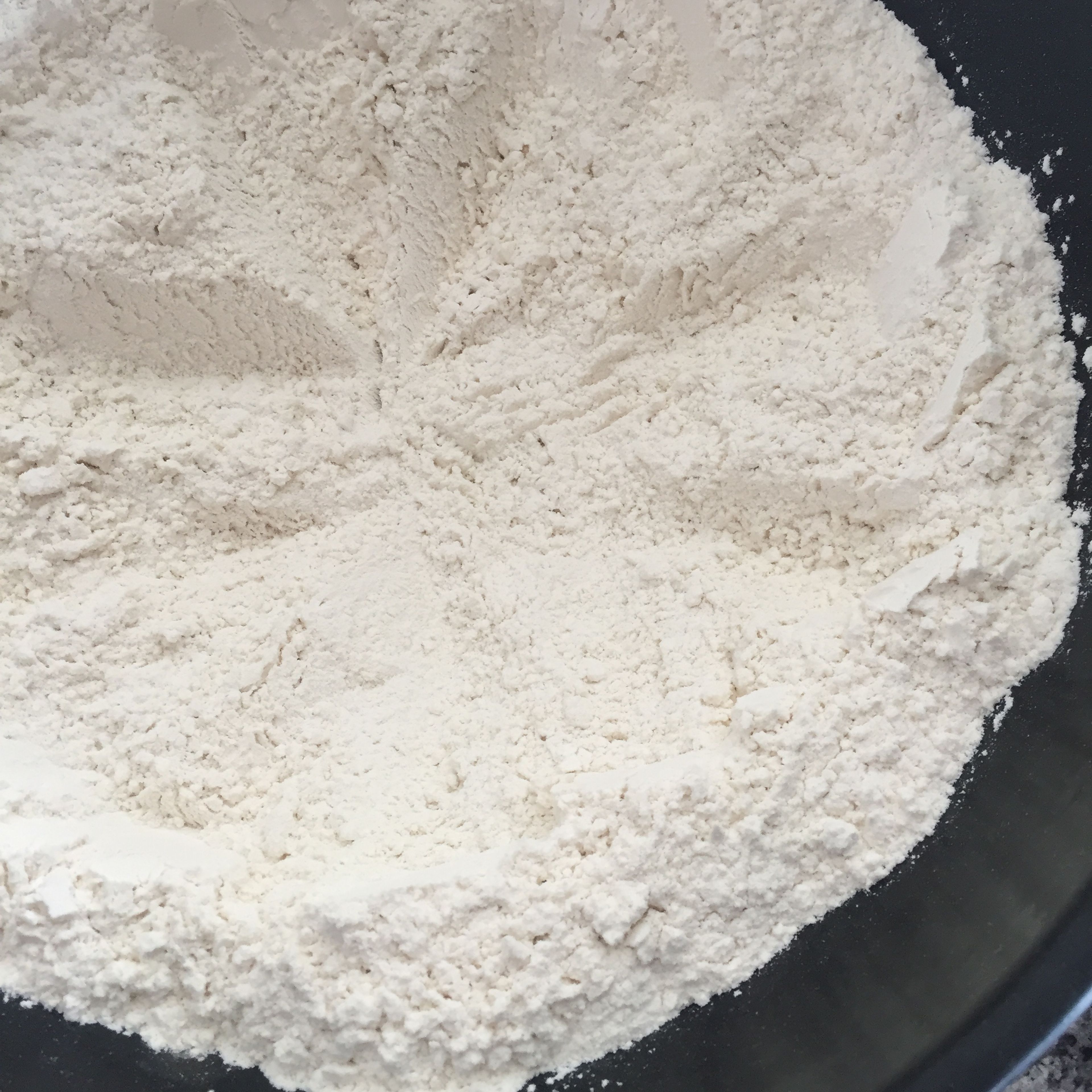 place flour in a bowl, and add a pinch of salt to it