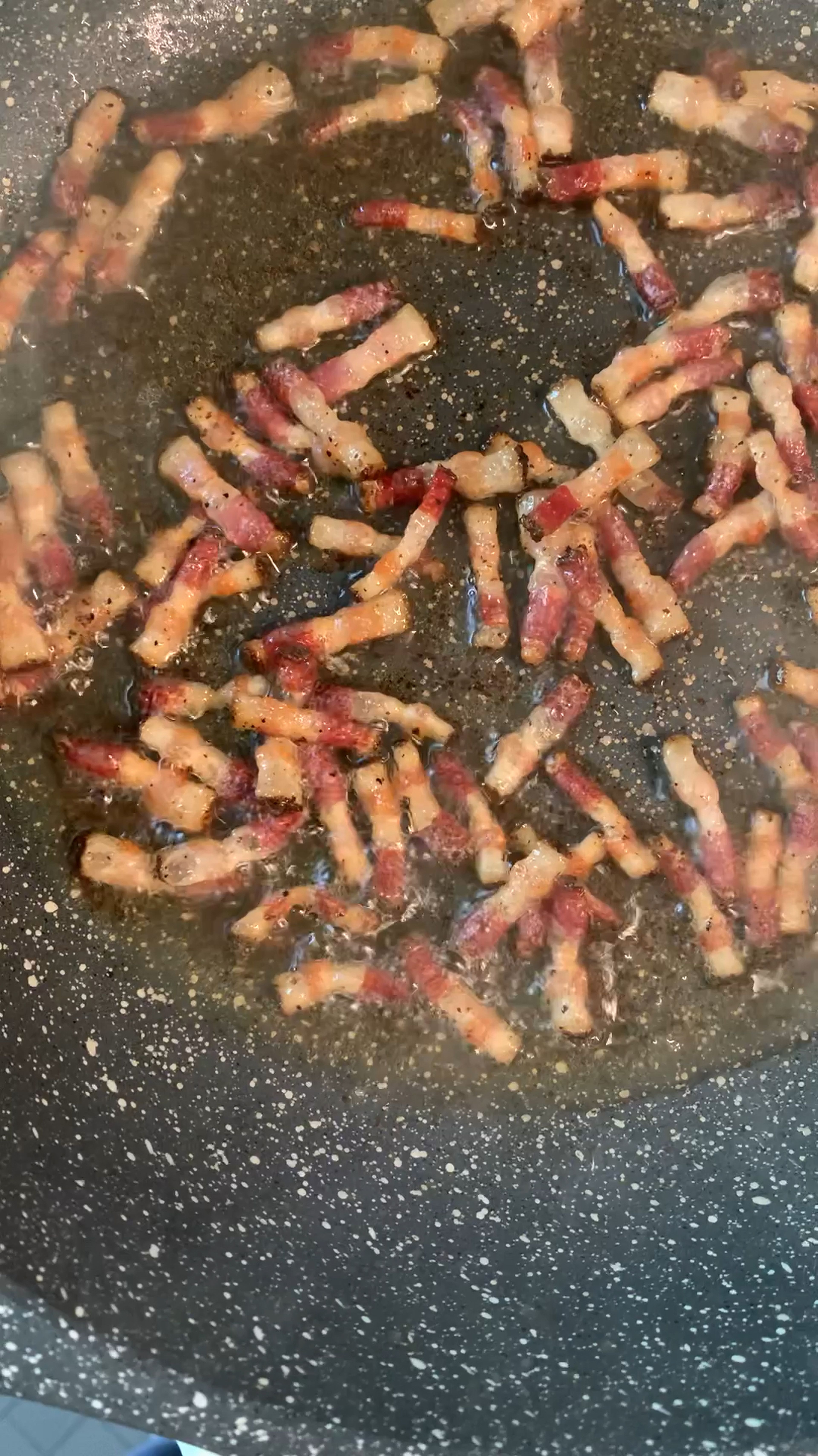 Take any kind of pancetta and cut it into small chunks and add them to a pan. Fry in sizzling oil until they turn golden and crunchy. Drain pancetta and save remaining fat for pasta.