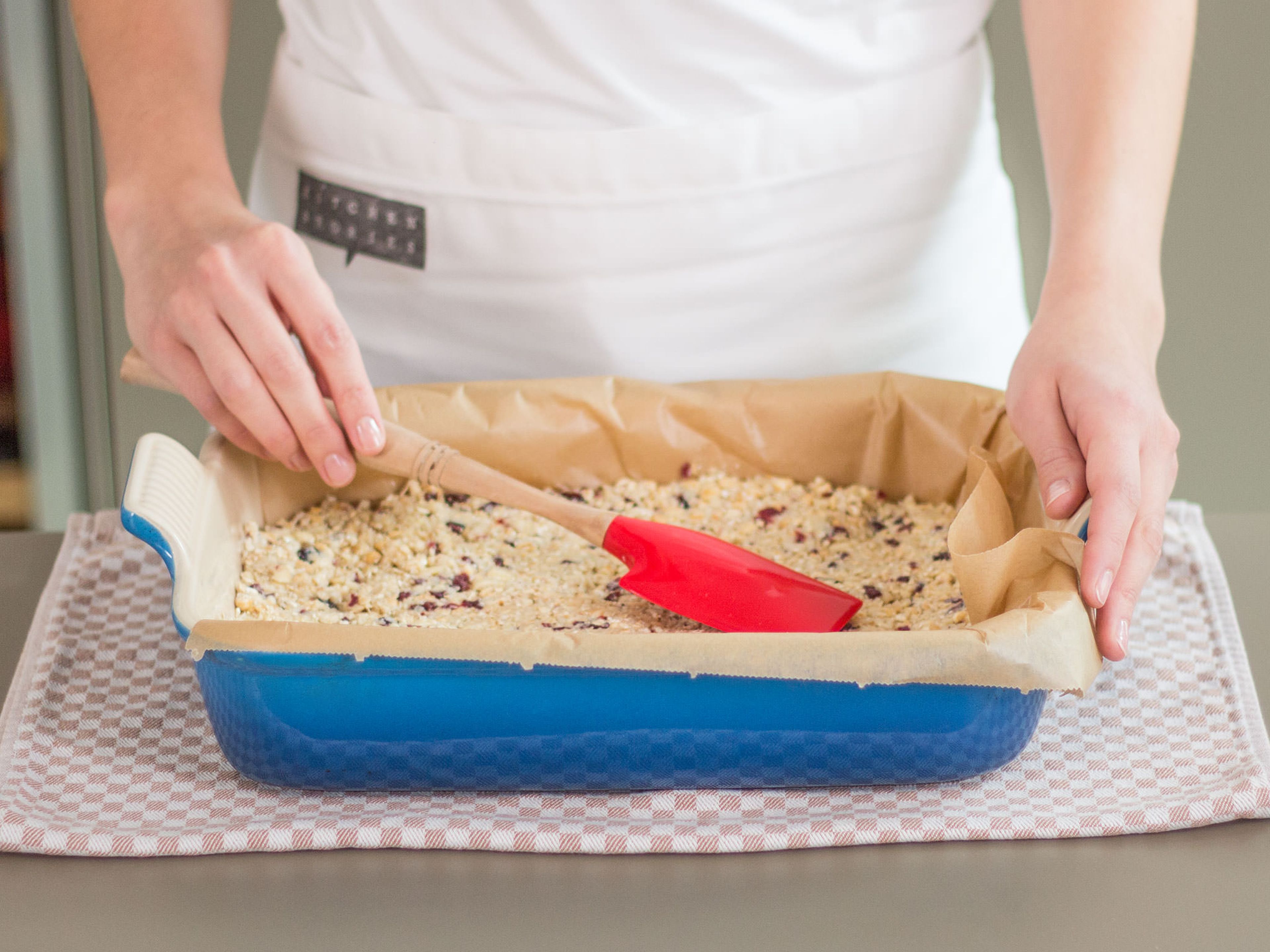 Transfer breakfast bar mixture to a parchment-lined baking dish and smooth top with a spatula. Place in preheated oven and bake at 130°C/270°F for approx. 45 – 50 min. until golden. Remove from oven and let cool for approx. 10 min.