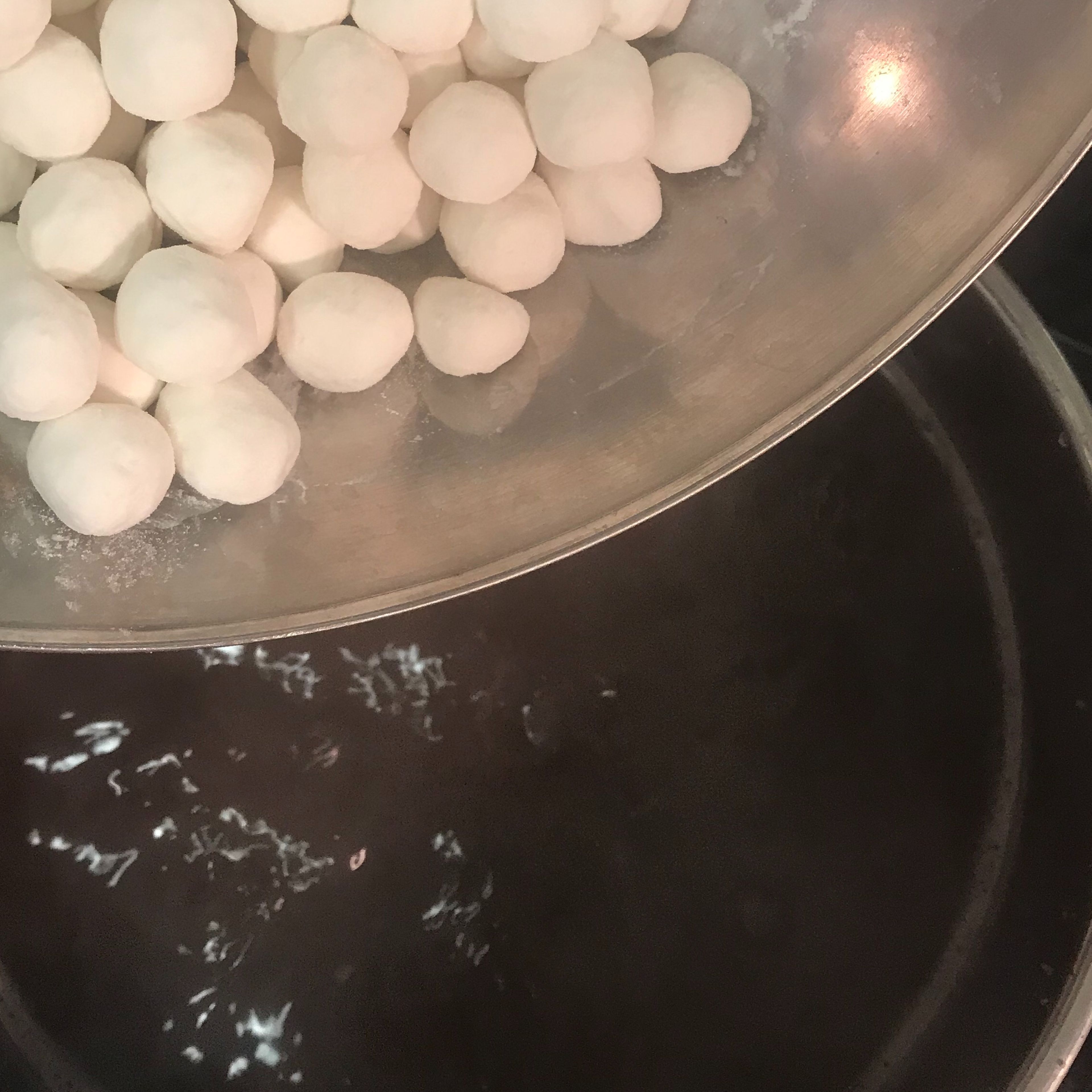 When you finish making the sticky rice dumplings, taste one red bean from the soup. If it is already soft, then it is almost done! If you think the soup is not sweet enough, you can still add more sugar now. Pour all the sticky rice dumplings you made into the soup.