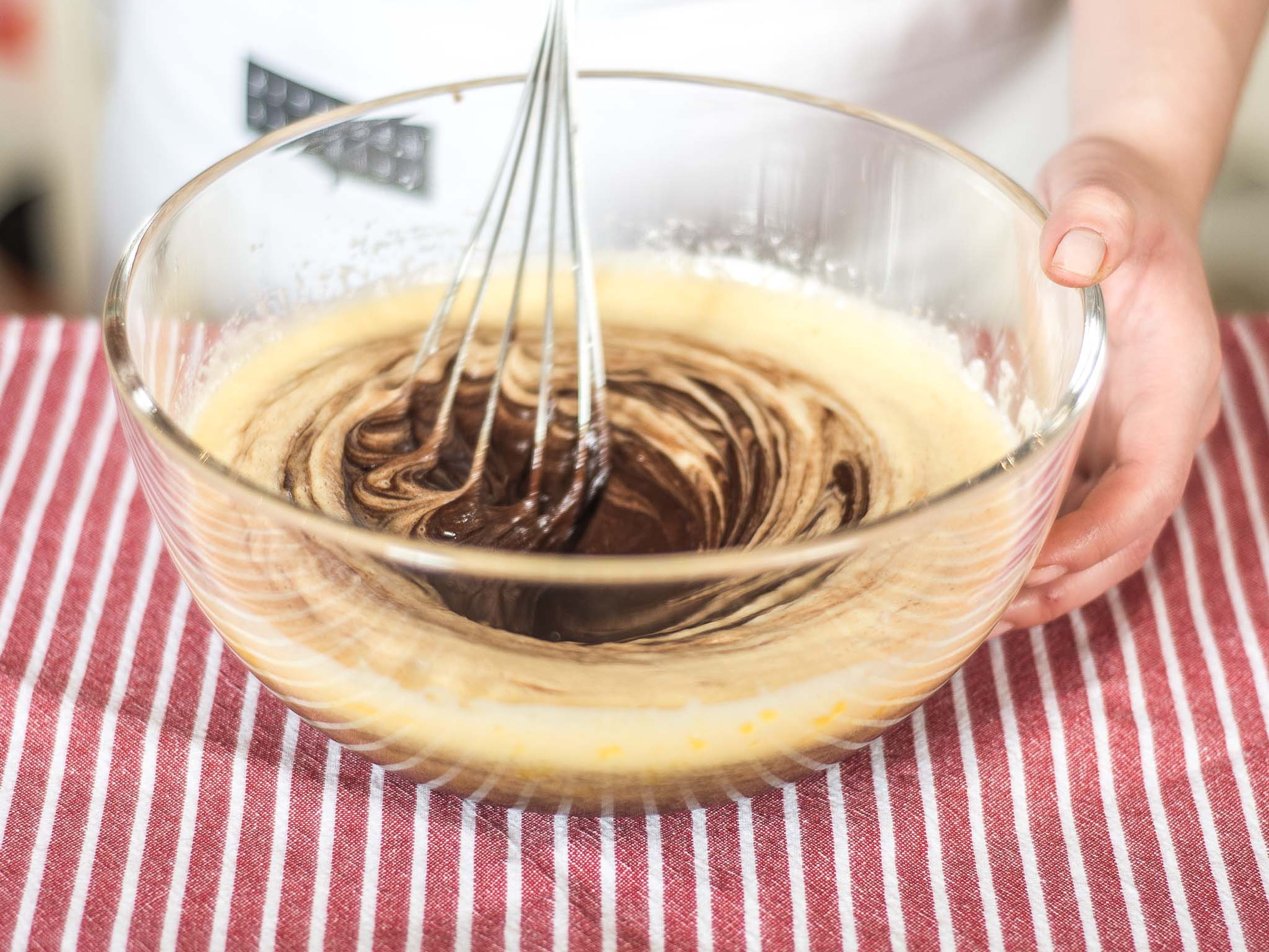 Next, add the melted chocolate to the egg mixture and stir together until a smooth batter forms.