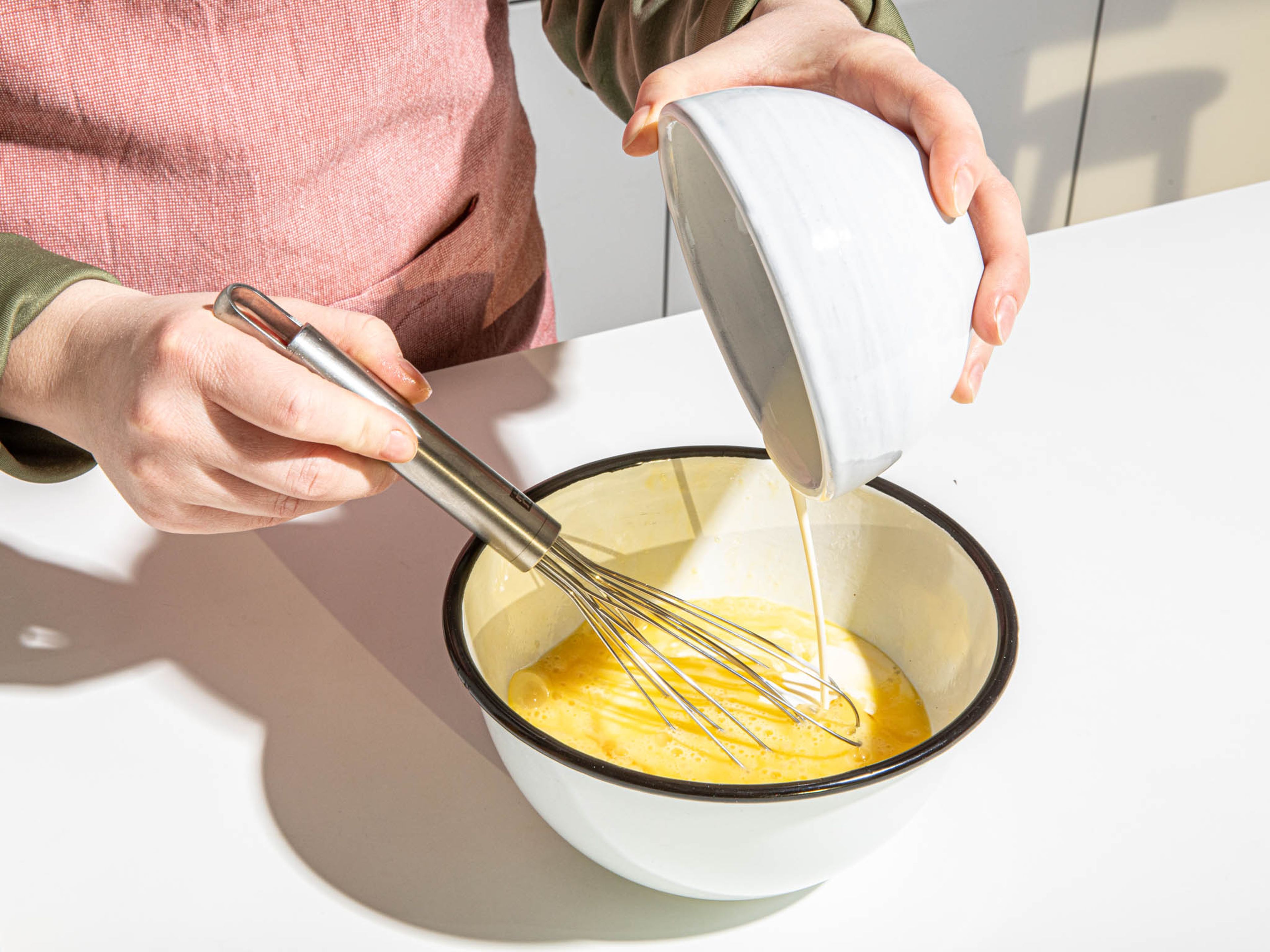 In a small bowl, beat eggs until frothy. Then add cream, salt, and pepper, and whisk to combine.