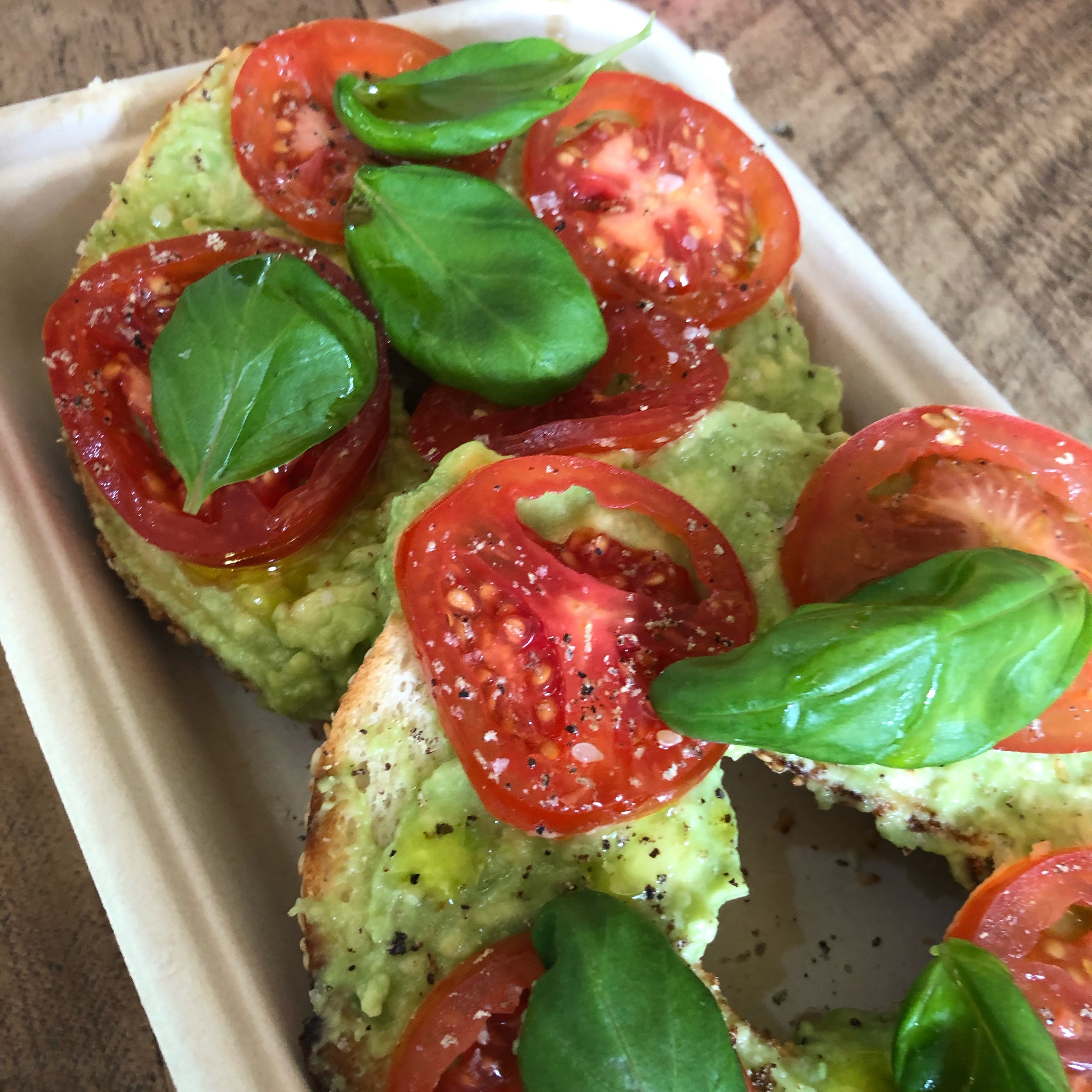 Bagels with avocado, tomato and basil