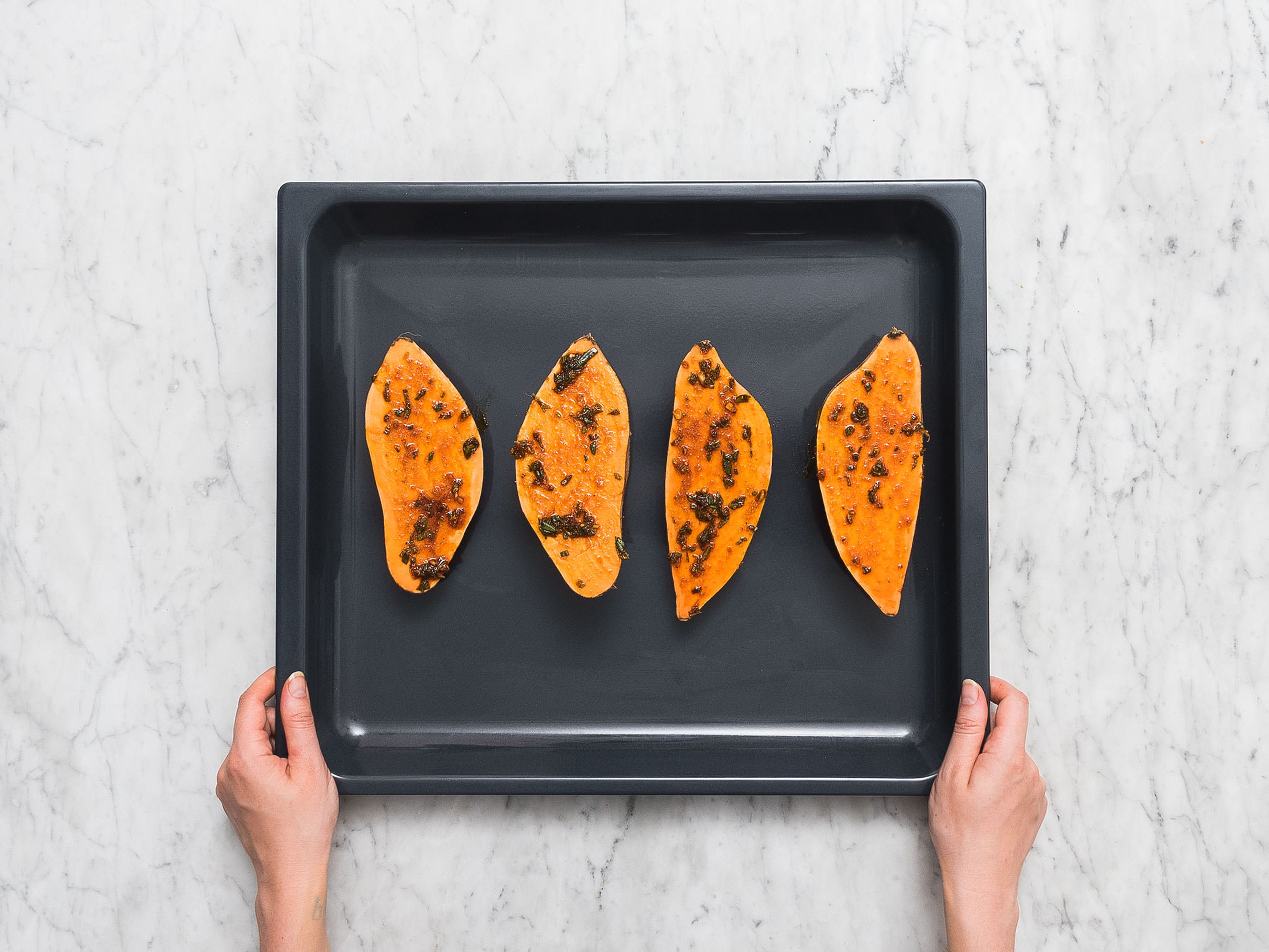 Halve sweet potatoes and brush with marinade. Transfer sweet potatoes to a parchement-lined baking sheet and bake at 220°C/425°F for approx. 15 min., or until fork-tender.