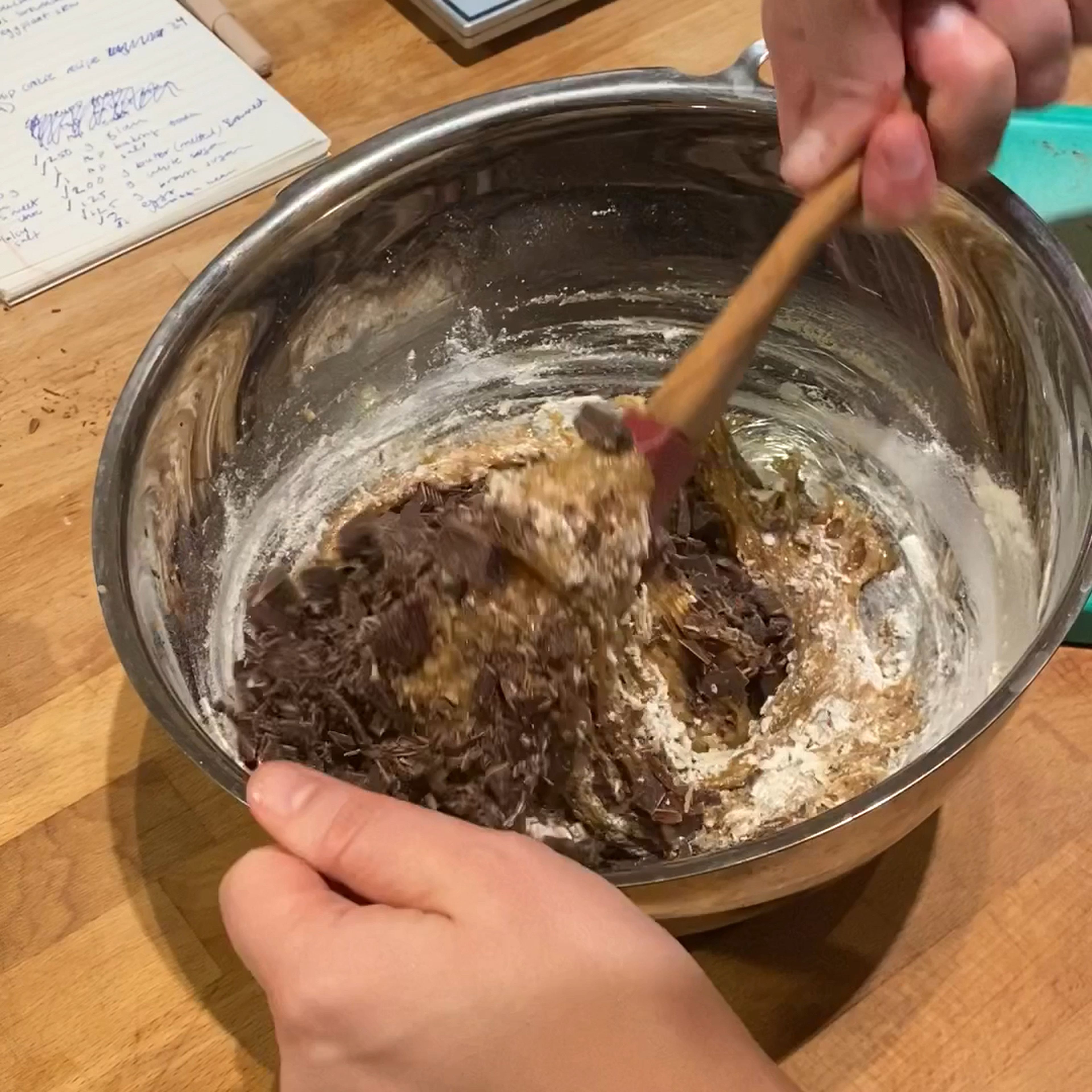 Add the flour mixture to the batter and fold until almost all incorporated but not quite. Add the chopped chocolate and continue to fold until all is incorporated. Cover the dough with plastic wrap, pressing it against the dough to seal, and refrigerate for at least 1 hr. but best overnight.