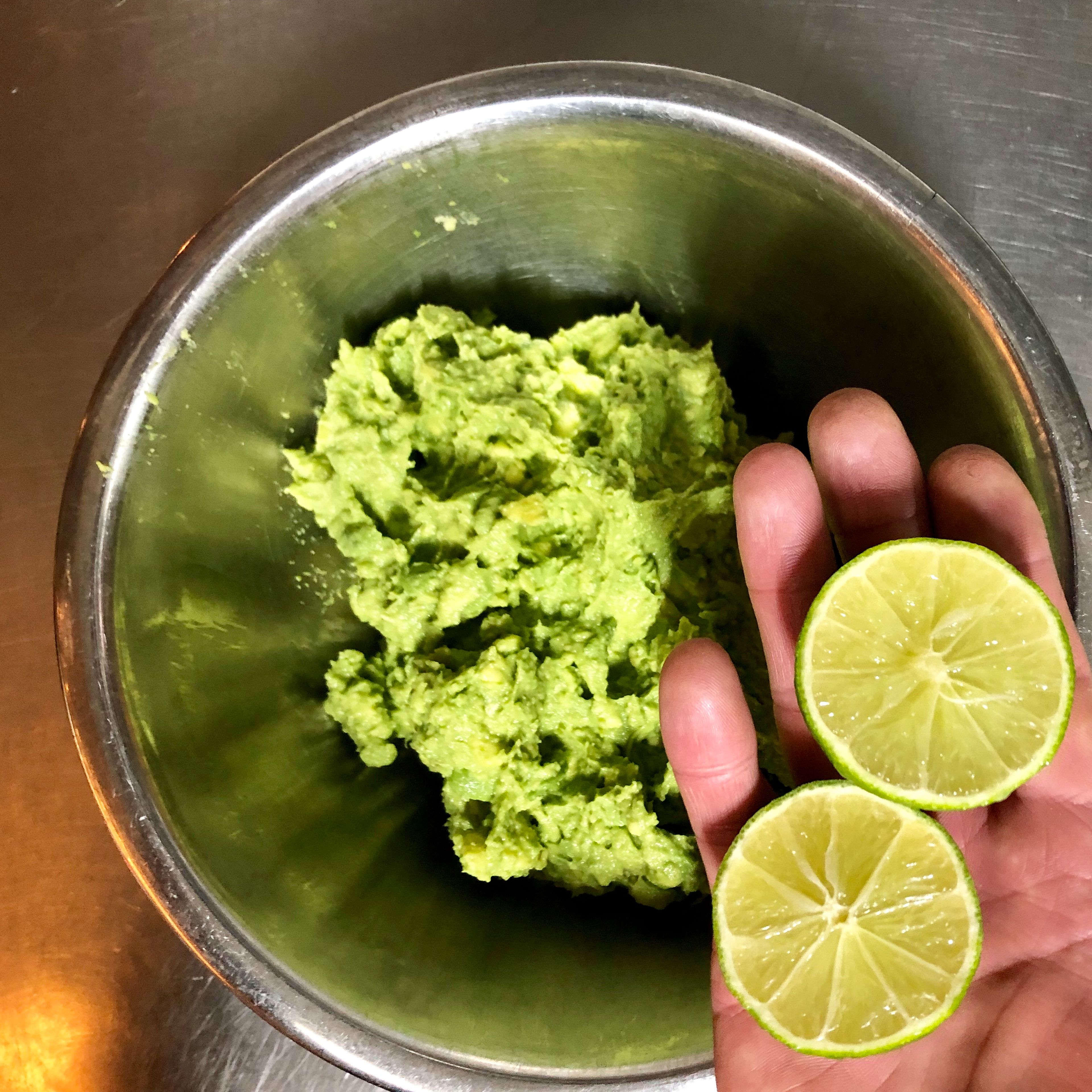 Cut the lime in half and squeeze the juice into the bowl.