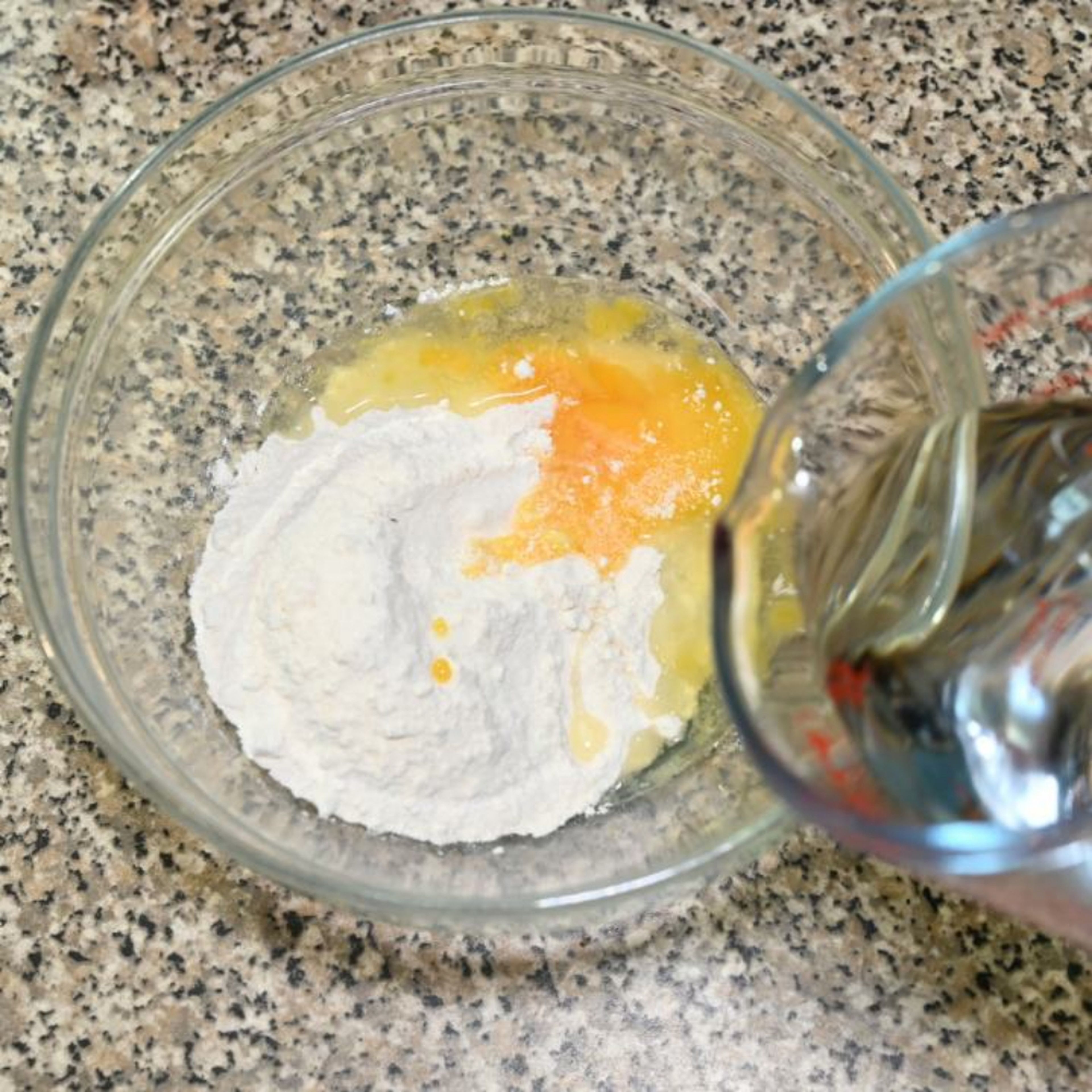 Prepare the coating batter: in a bowl add the flour, egg and a pinch of salt and gradually add water to get a thick consistency.