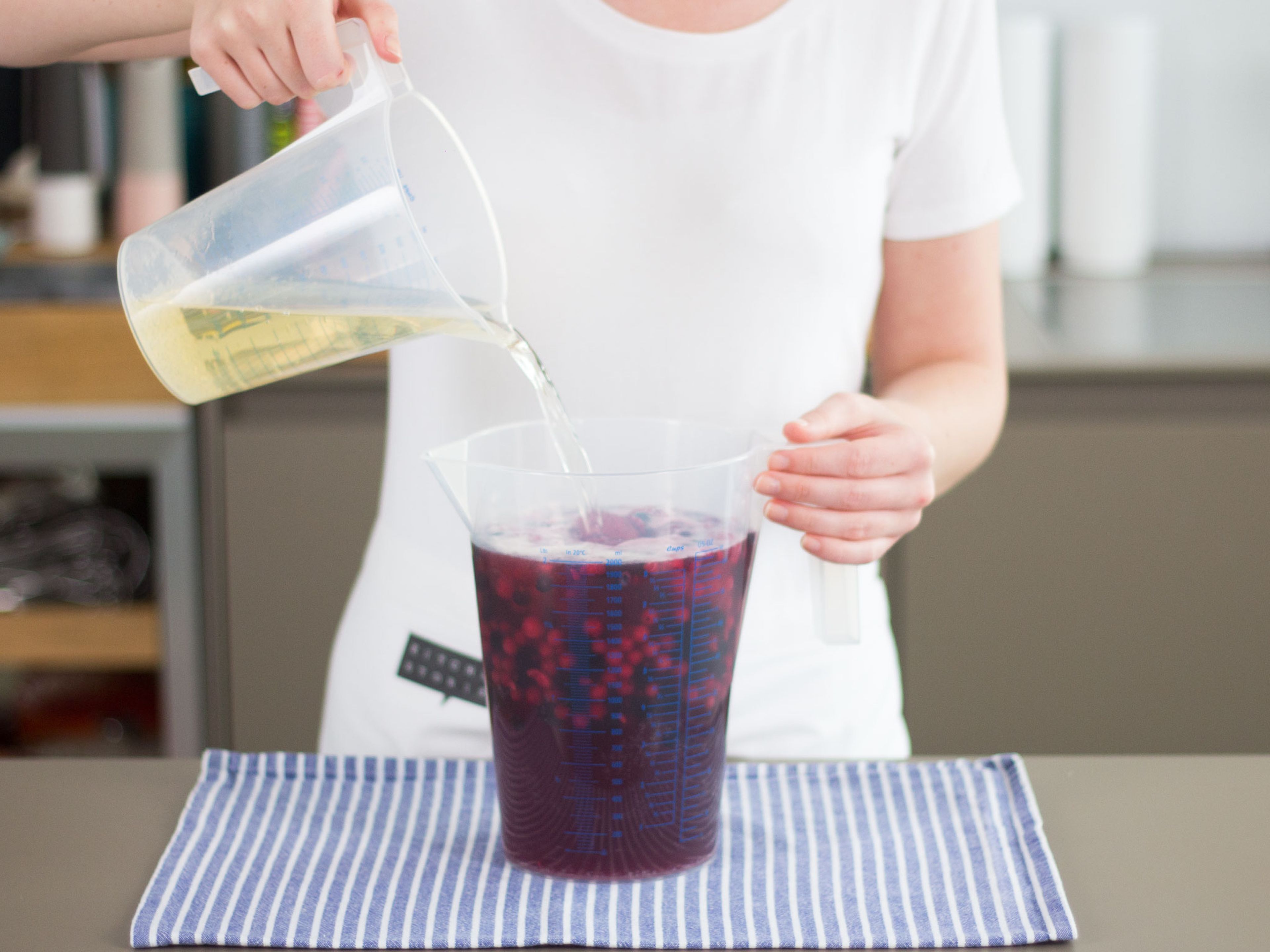 Combine the sparkling wine, wheat beer, raspberry syrup and mixed frozen berries in a measuring cup.