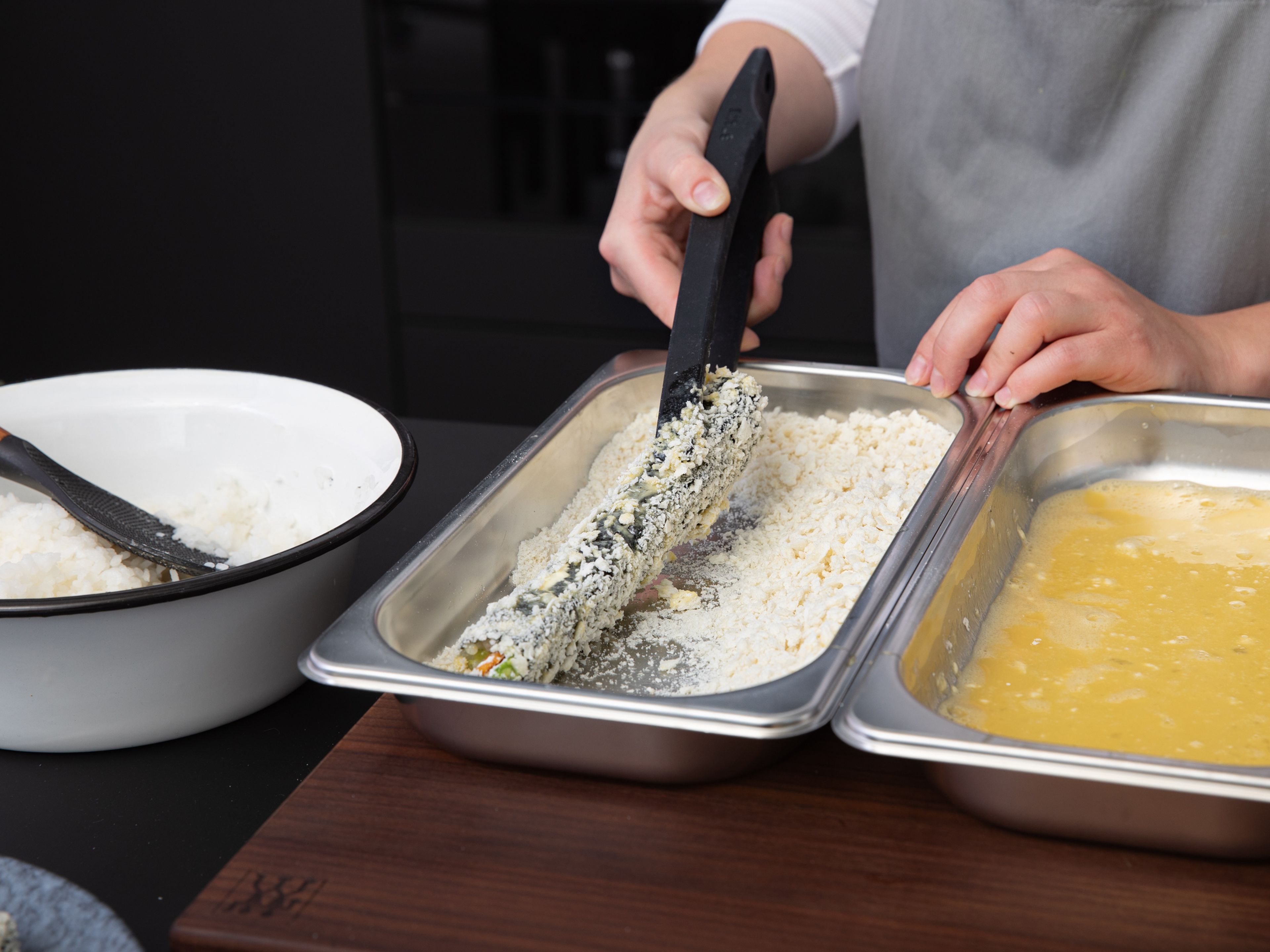 Roll together tightly using the sushi mat. Add the flour, eggs, and panko to separate deep plates or bowls. Dredge the sushi rolls first in flour, then egg, then panko.