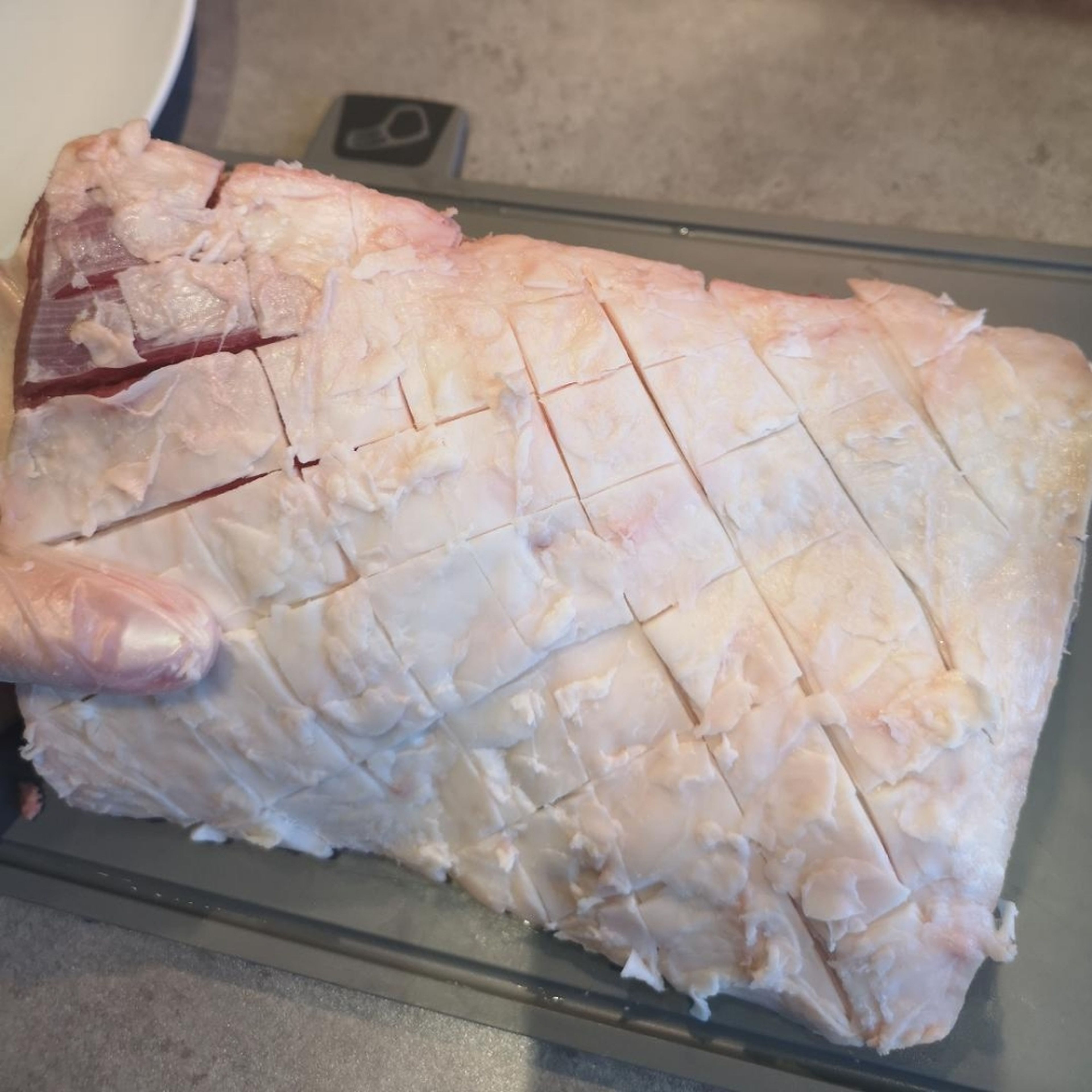 Score the fatty part of the rack, do it in a way that you don't cut too deep, you should only be scoring the fat, not the meat. Season generously with salt and pepper. tip: like to use a pairing knife to score as I feel it's easier with the short sharp blade.