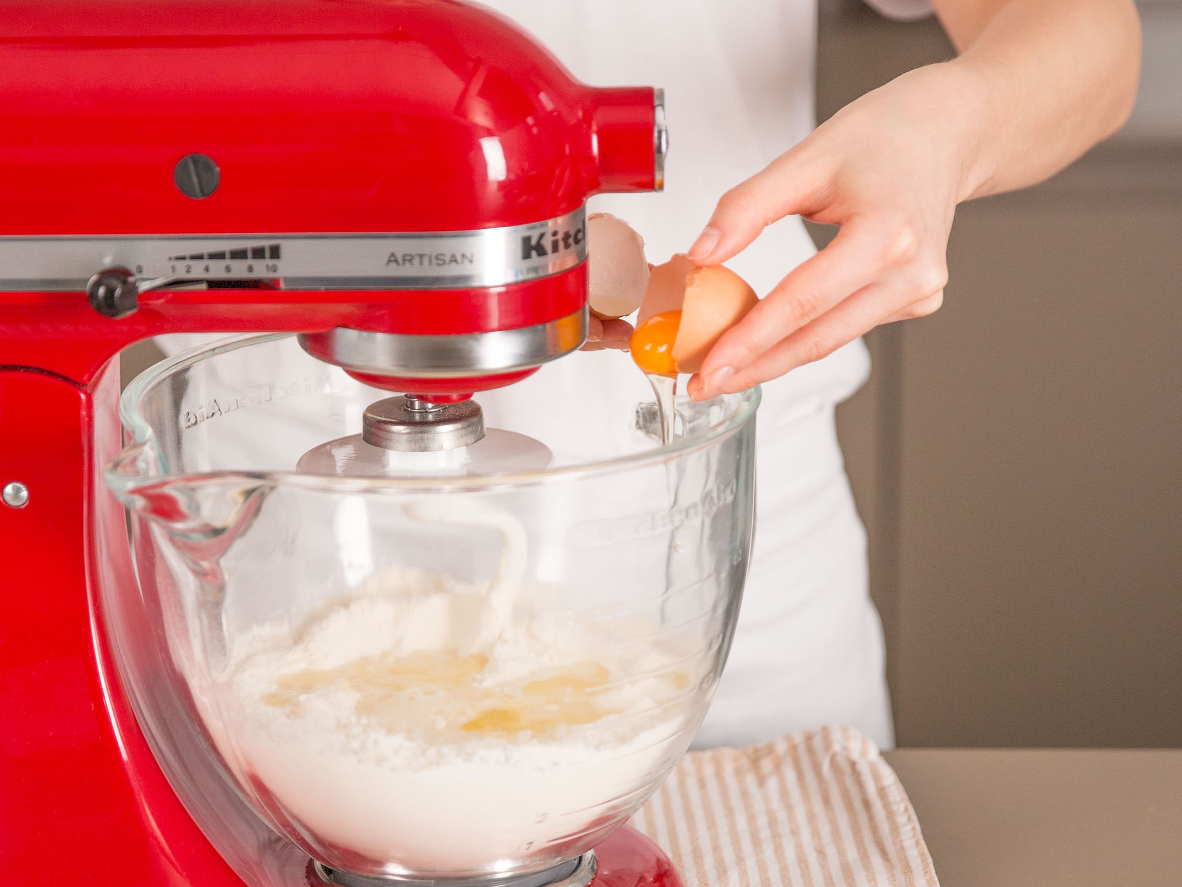 In a stand mixer, beat together flour, sugar, yeast, milk mixture, egg, and a pinch of salt for approx. 2 – 4 min. until a smooth dough forms. Turn out dough onto a floured work surface, gently kneed, return to bowl, cover, and place in a warm place to rise for approx. 90 min.