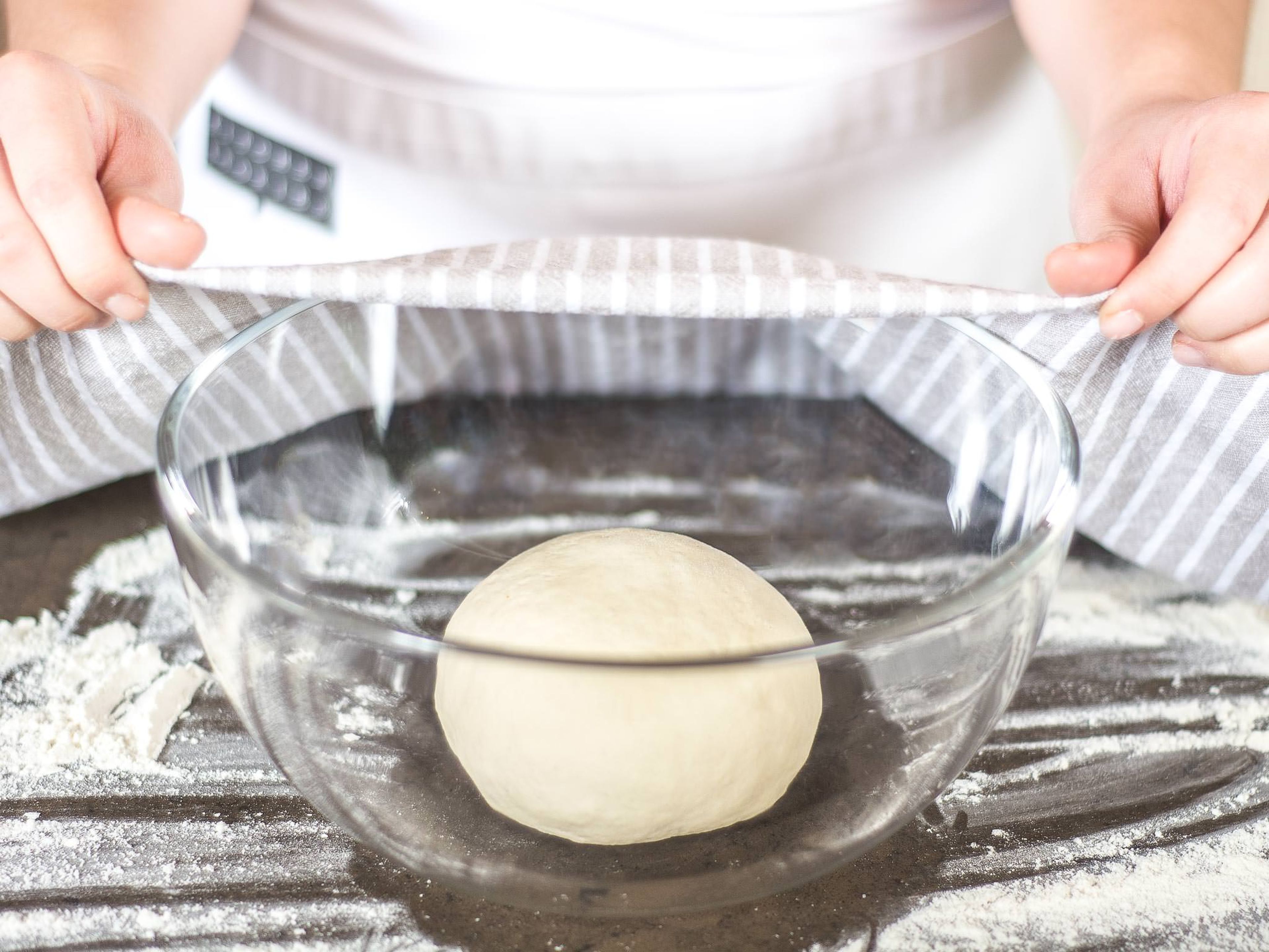Cover the dough with a kitchen towel and allow to rise in a warm place for approx. 1–2 hrs., until it has doubled in size.