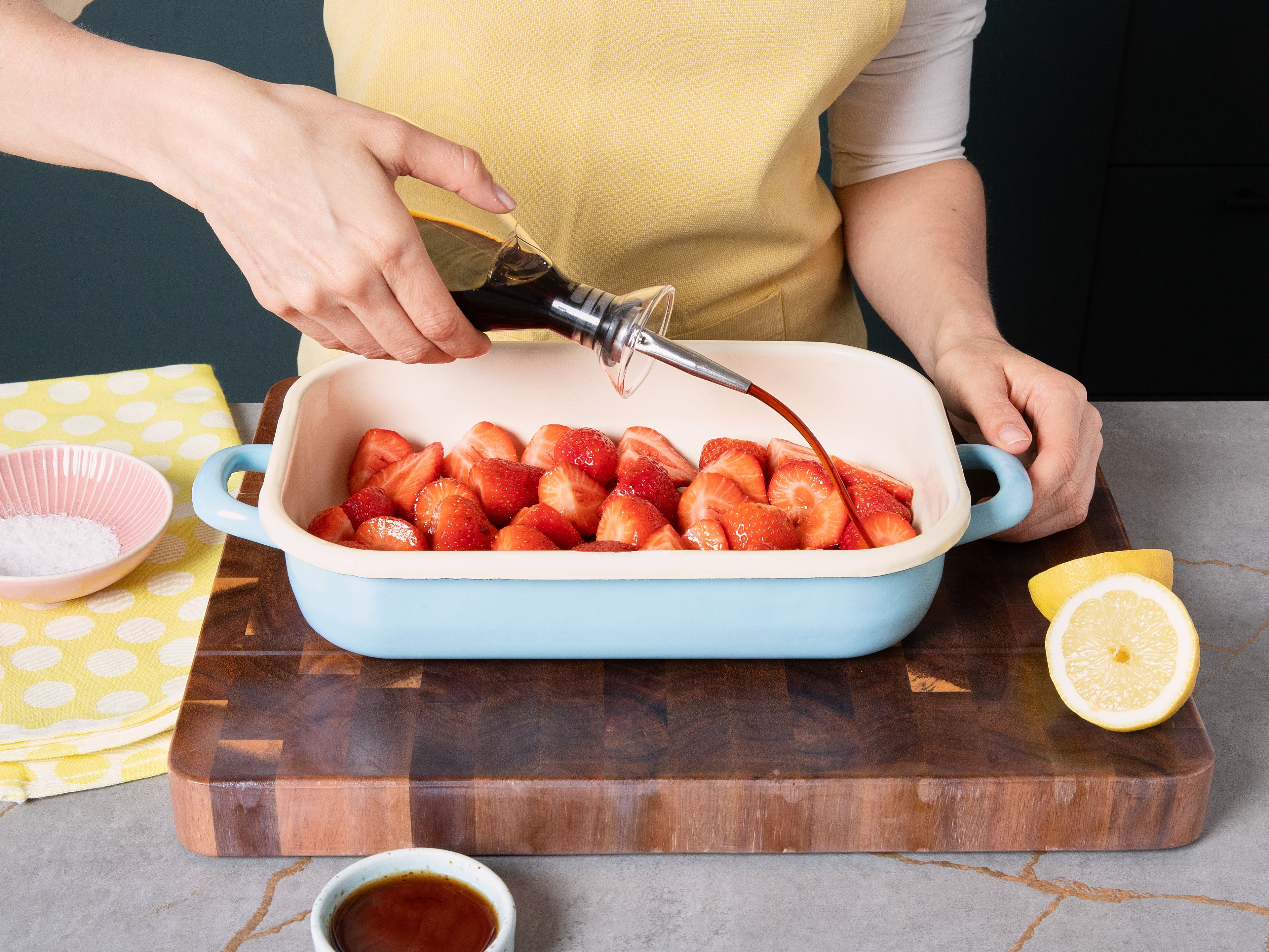 Preheat oven to 200°C/392°F. Remove green tops off strawberries, leaving smaller ones whole, and place on a baking dish. Drizzle balsamic vinegar and maple syrup. Toss to combine and spread in a single layer.
