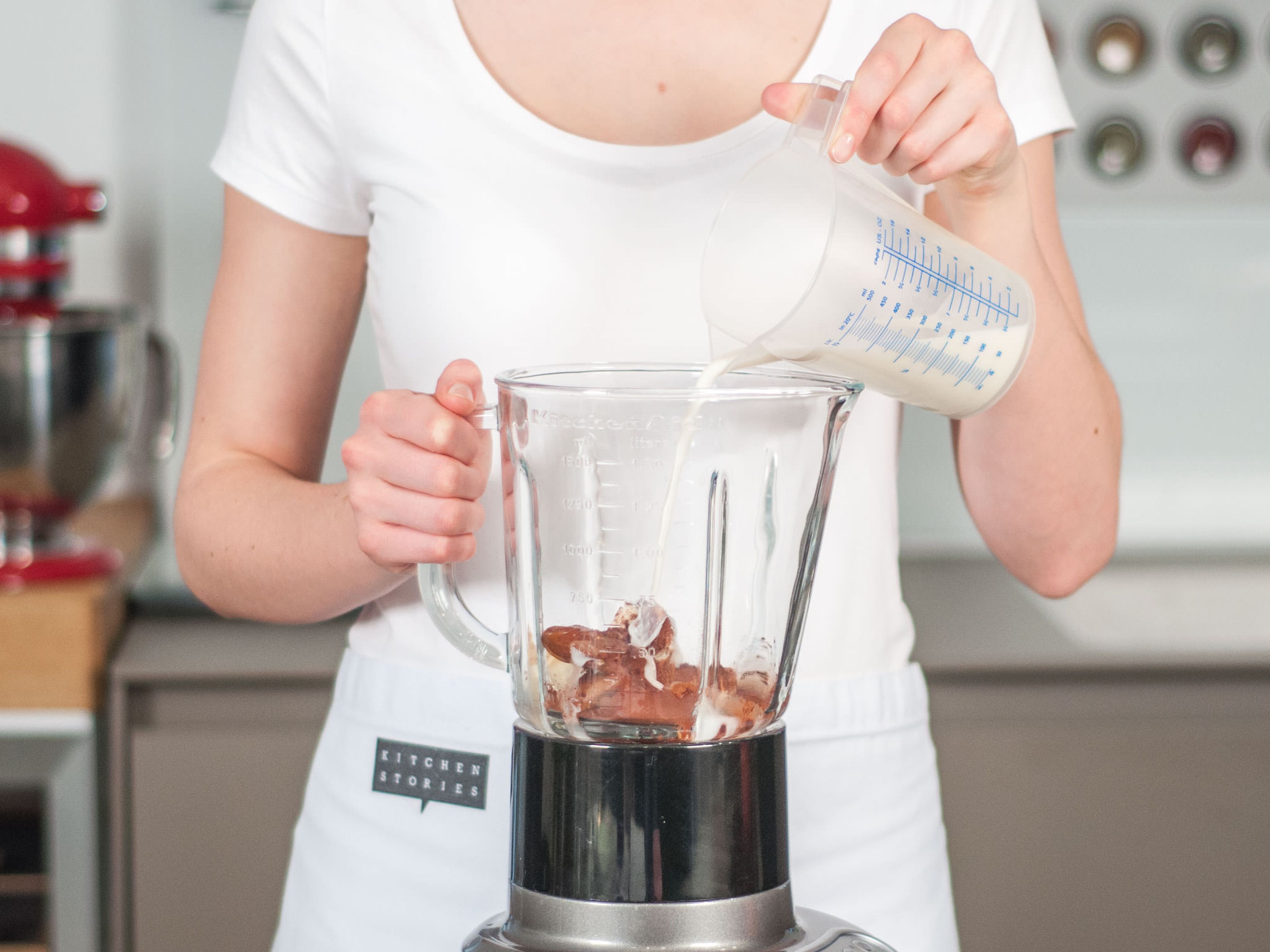 Add ice cubes to blender. Pour in almond milk and add almond butter if desired.