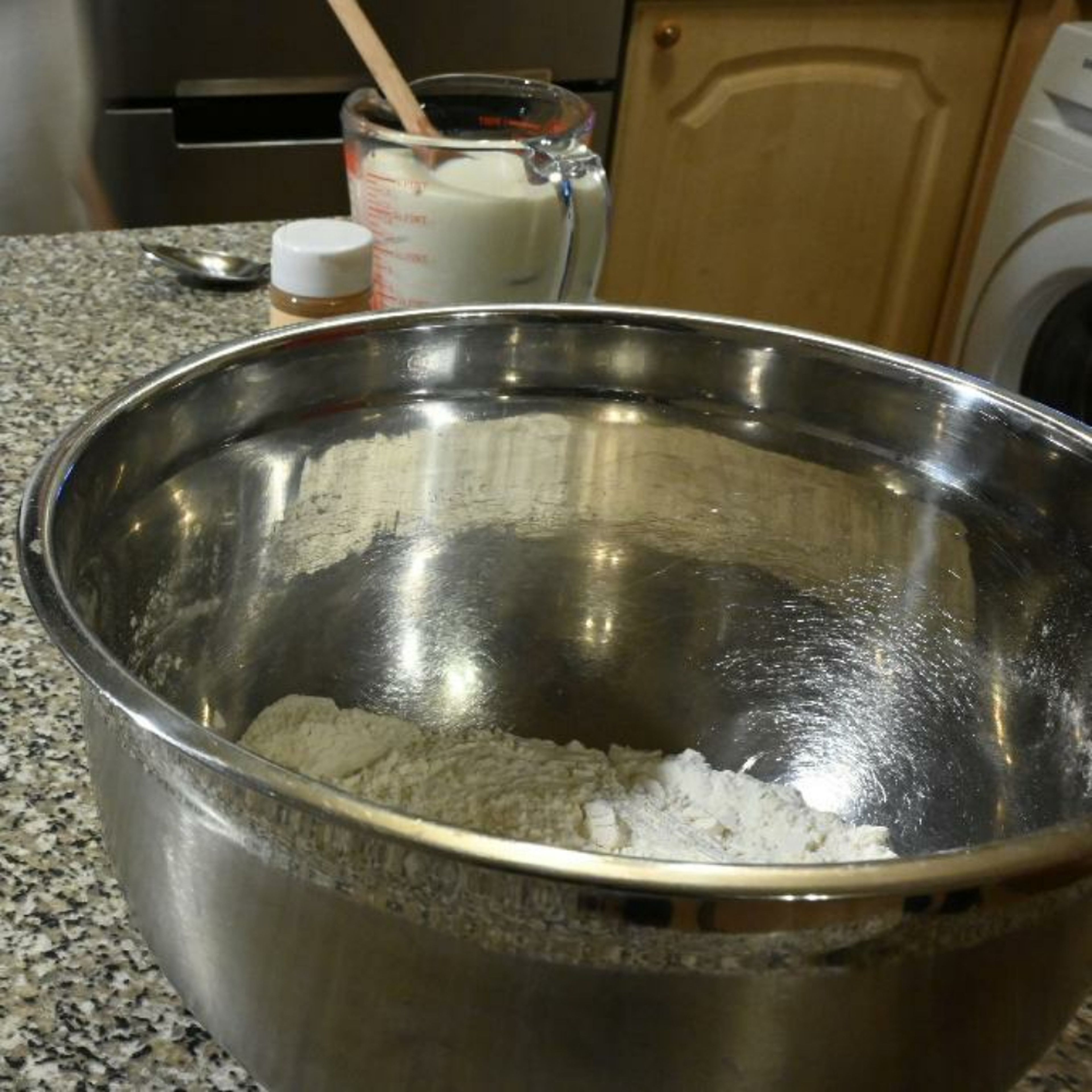 In a bowl, whisk together flour, baking powder and salt. In a separate small bowl, whisk together milk and maple syrup.