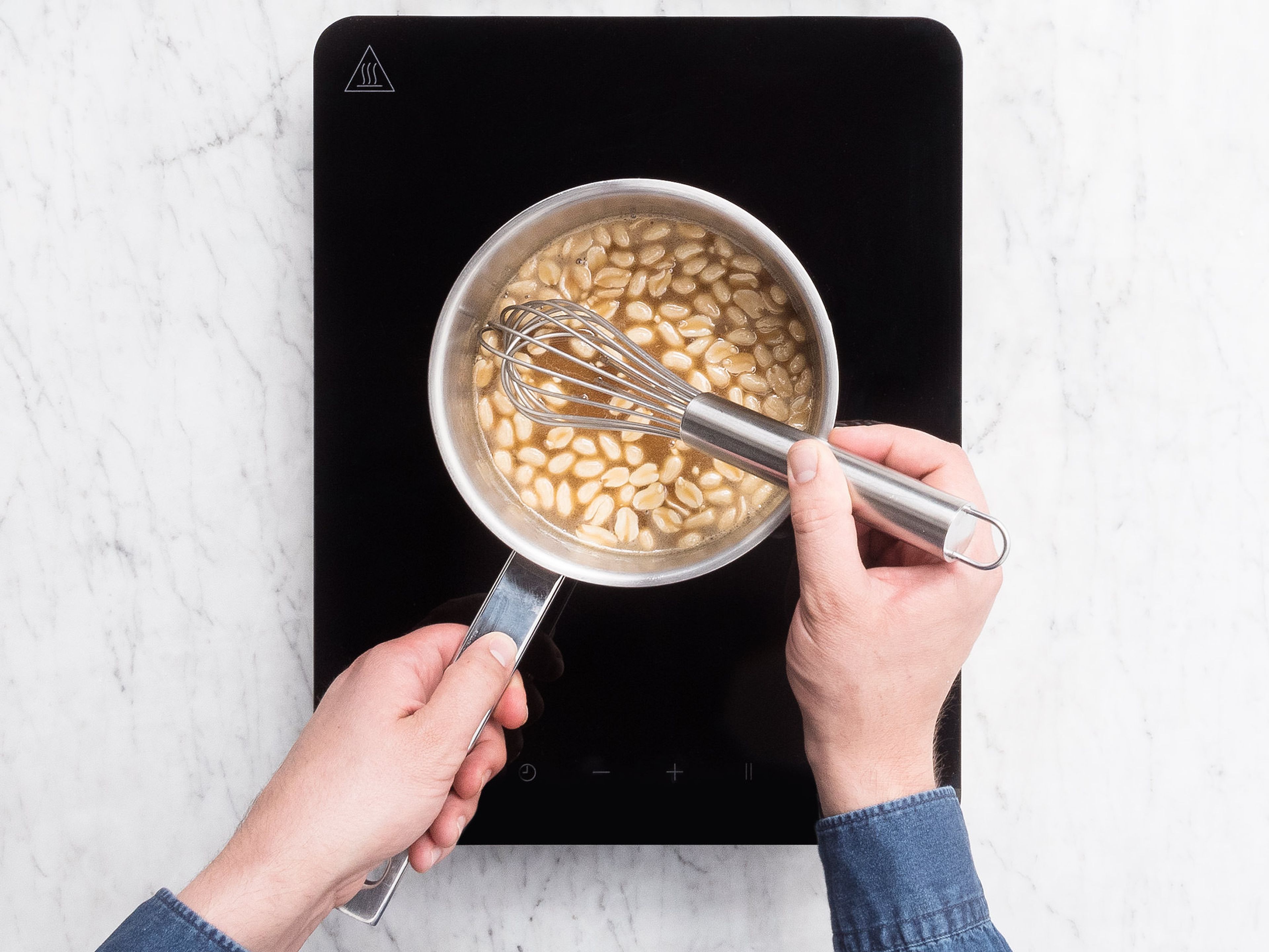 To make the honey caramel, place the remaining butter, honey, and salt to a pot over medium heat. Bring to a boil while whisking. Reduce heat to low and let simmer for approx. 10 min. until thickened. Remove from heat, stir in the roasted peanuts and let cool to room temperature.