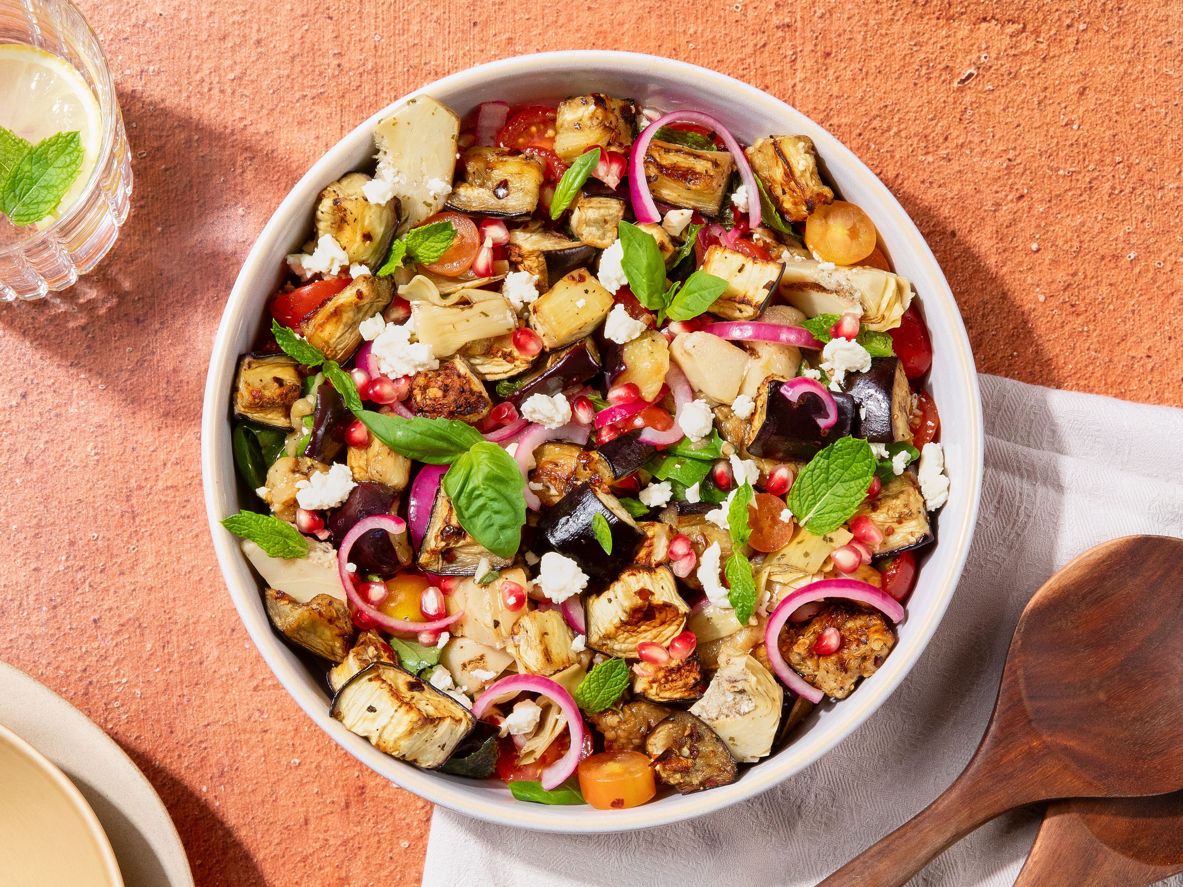 Warm eggplant salad with artichokes and pomegranate