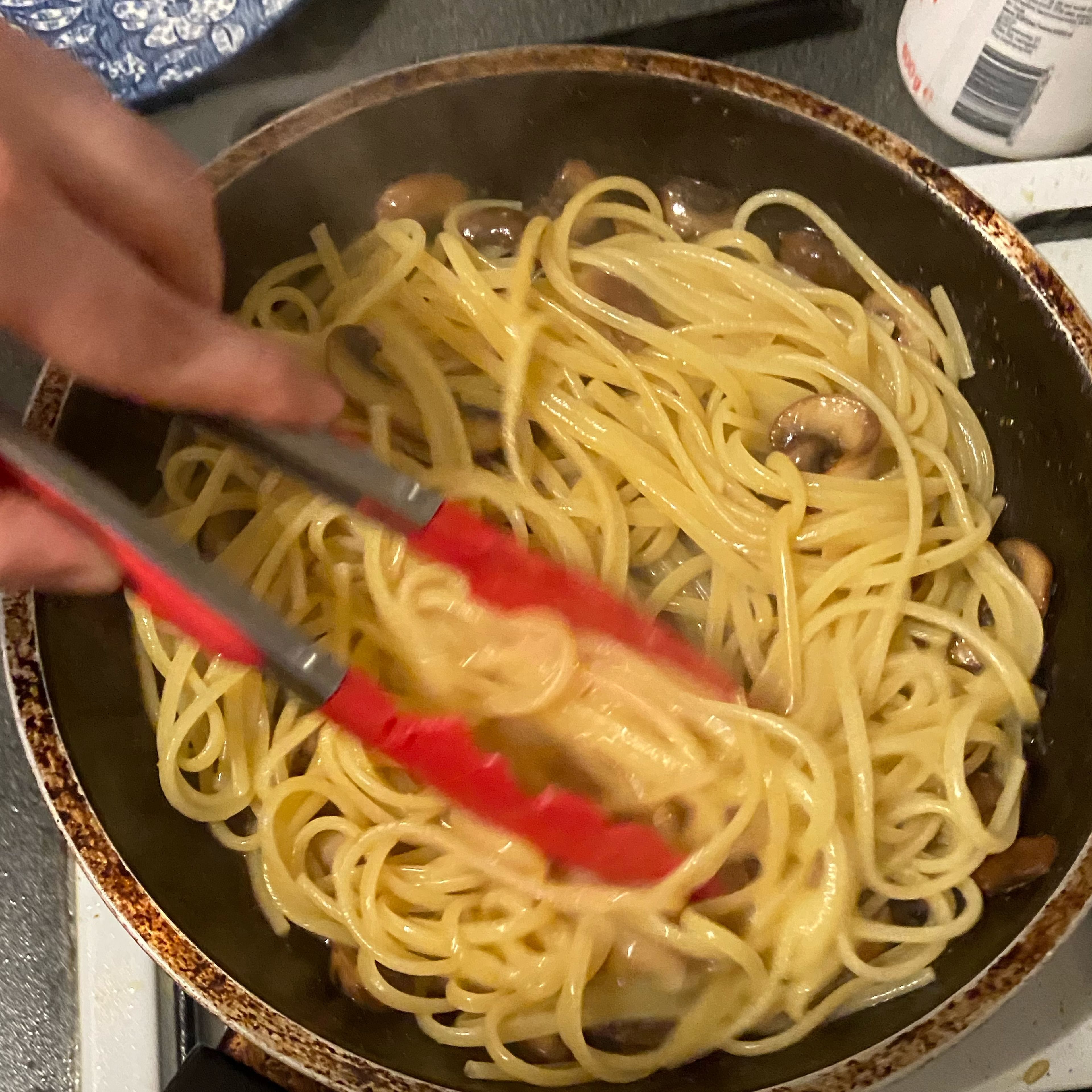 When pasta is done put in the pan and combine with the mushrooms. Add a bit of the pasta water