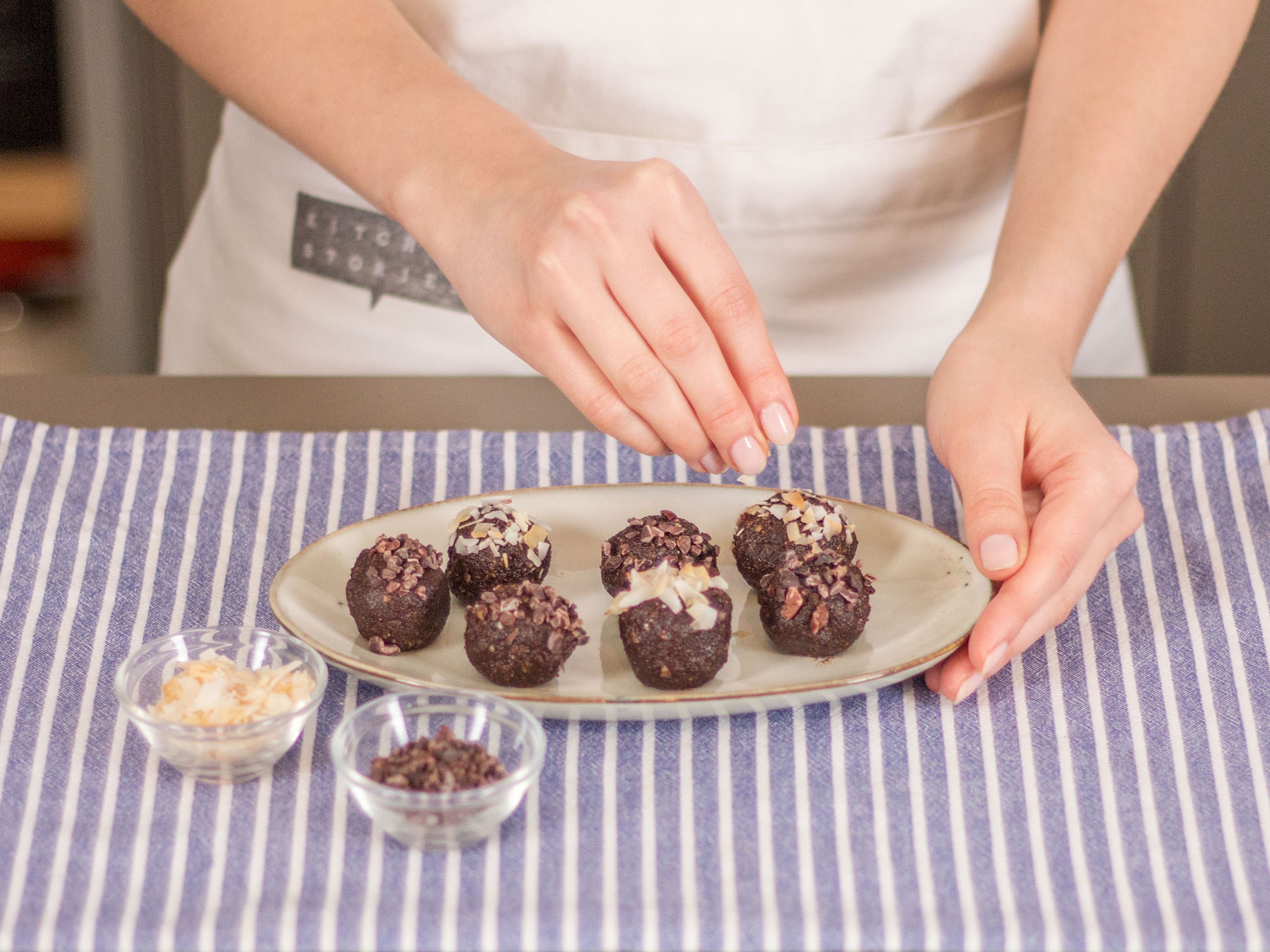 Take small portions of the dough (approx. 1.5 tbsp.) and roll each into a little ball. Sprinkle balls with remaining toasted coconut flakes and chocolate sprinkles. Enjoy!