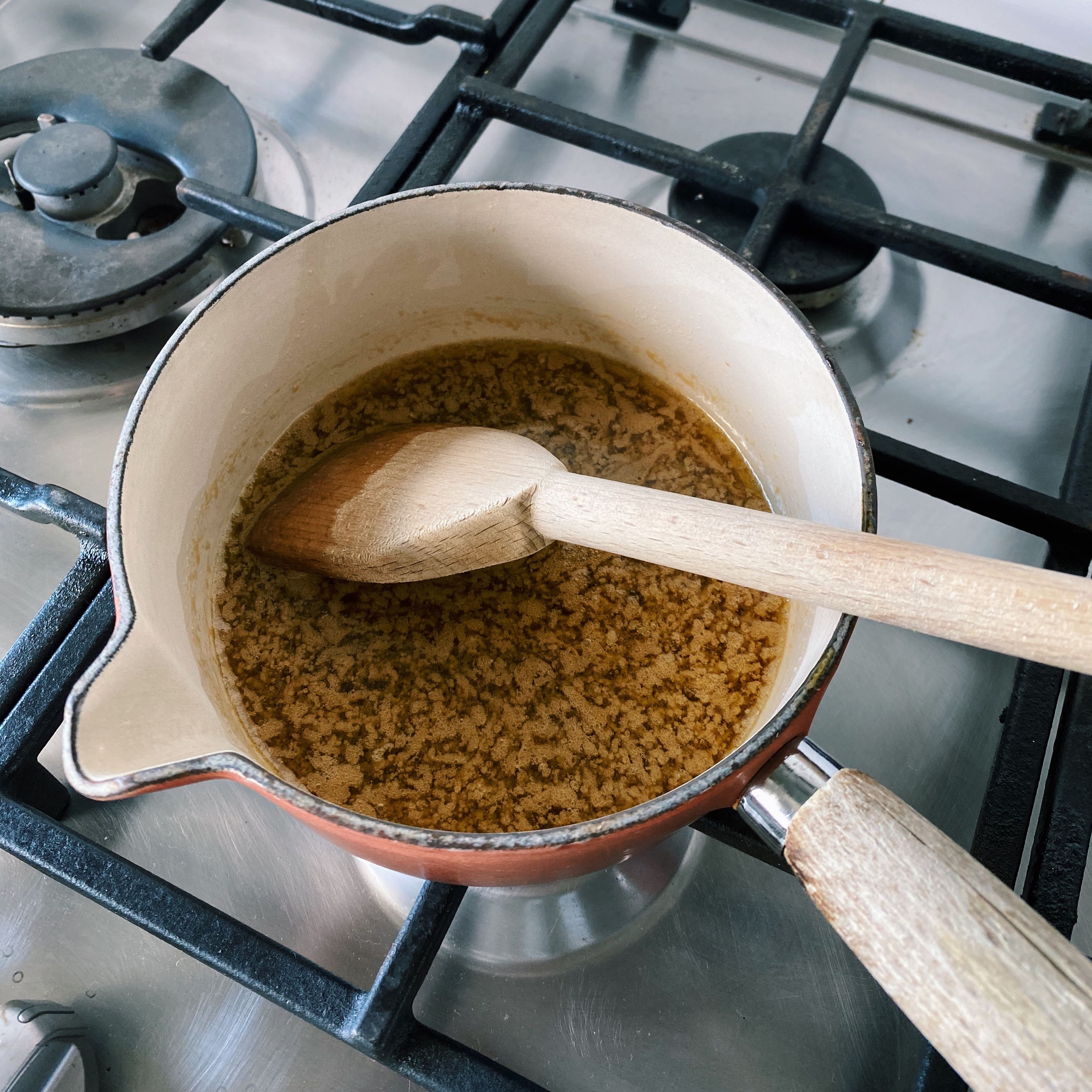 In a small/medium-sized pan, combine butter, golden syrup and sugars. Stir with a wooden spoon over a low heat until butter is melted.