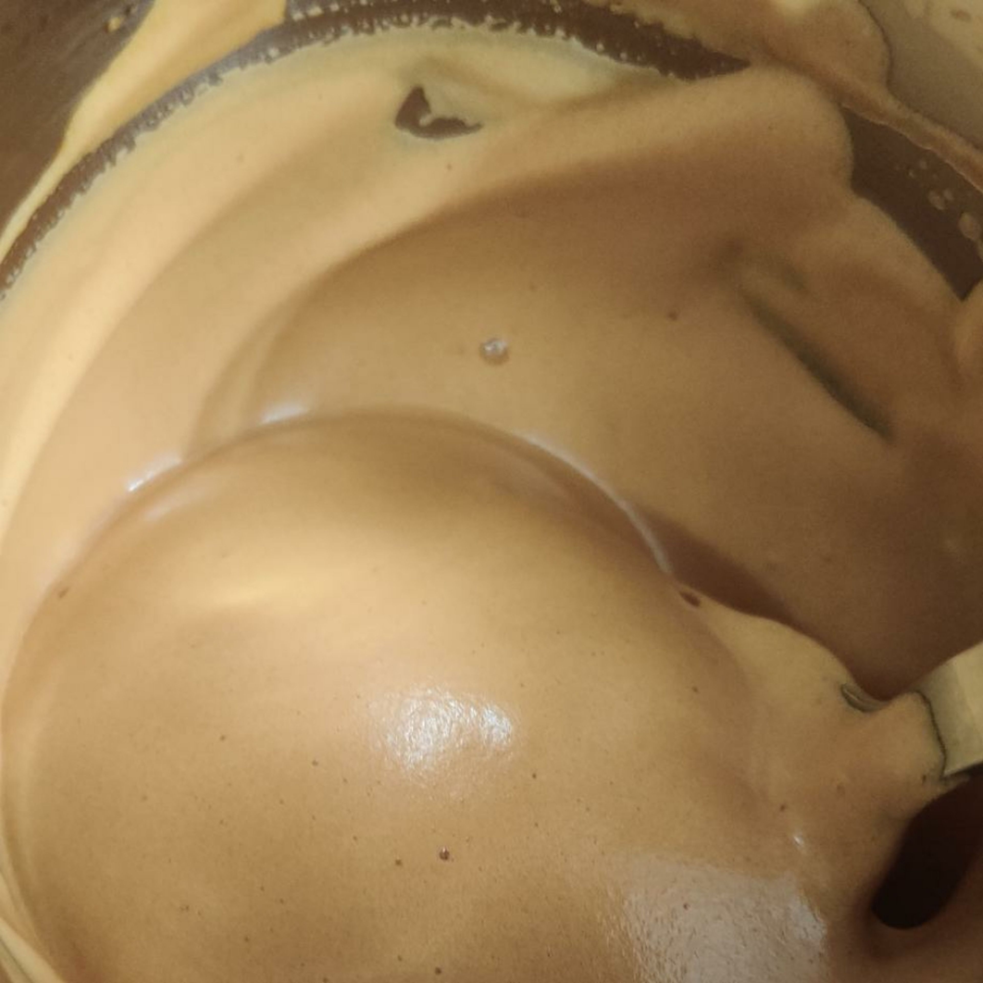 After 7 minutes of whisking coffee becomes creamy and lighter in color.