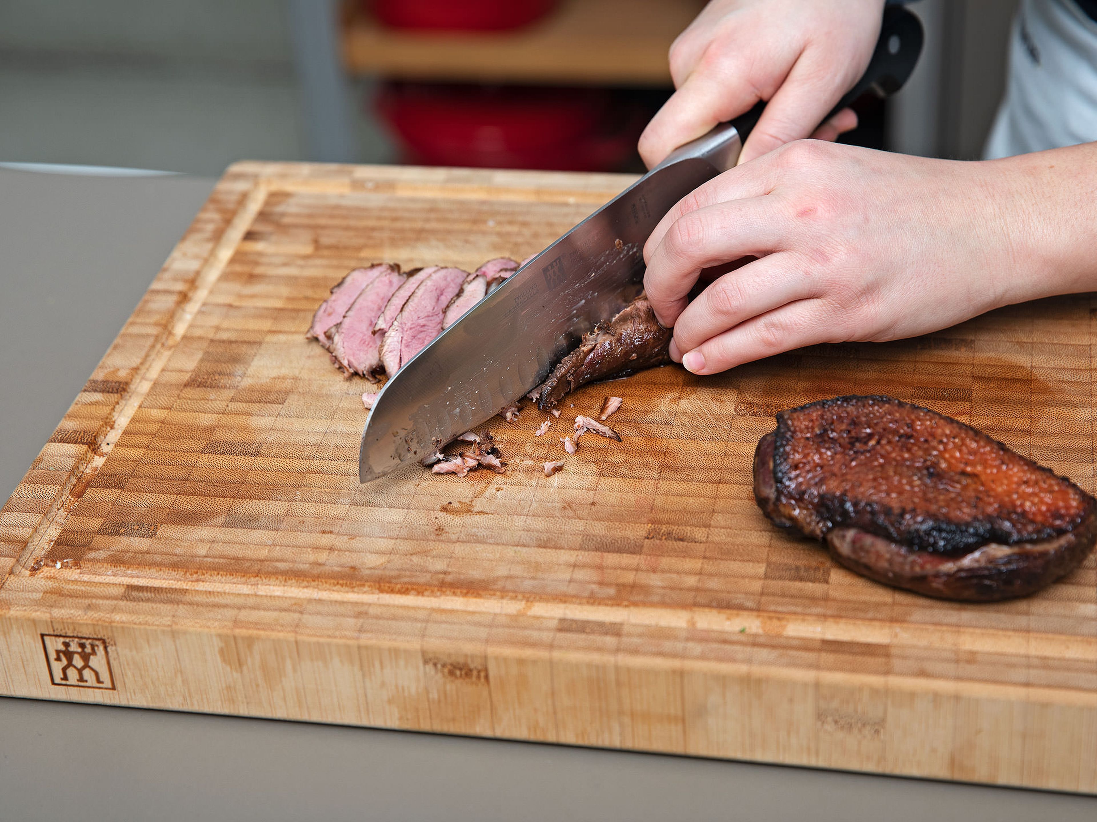 Turn up the oven to 230°C/450°F and roast duck breasts for  approx. 5 – 7 min., or until the skin gets really crispy. Remove from the oven and thinly slice.