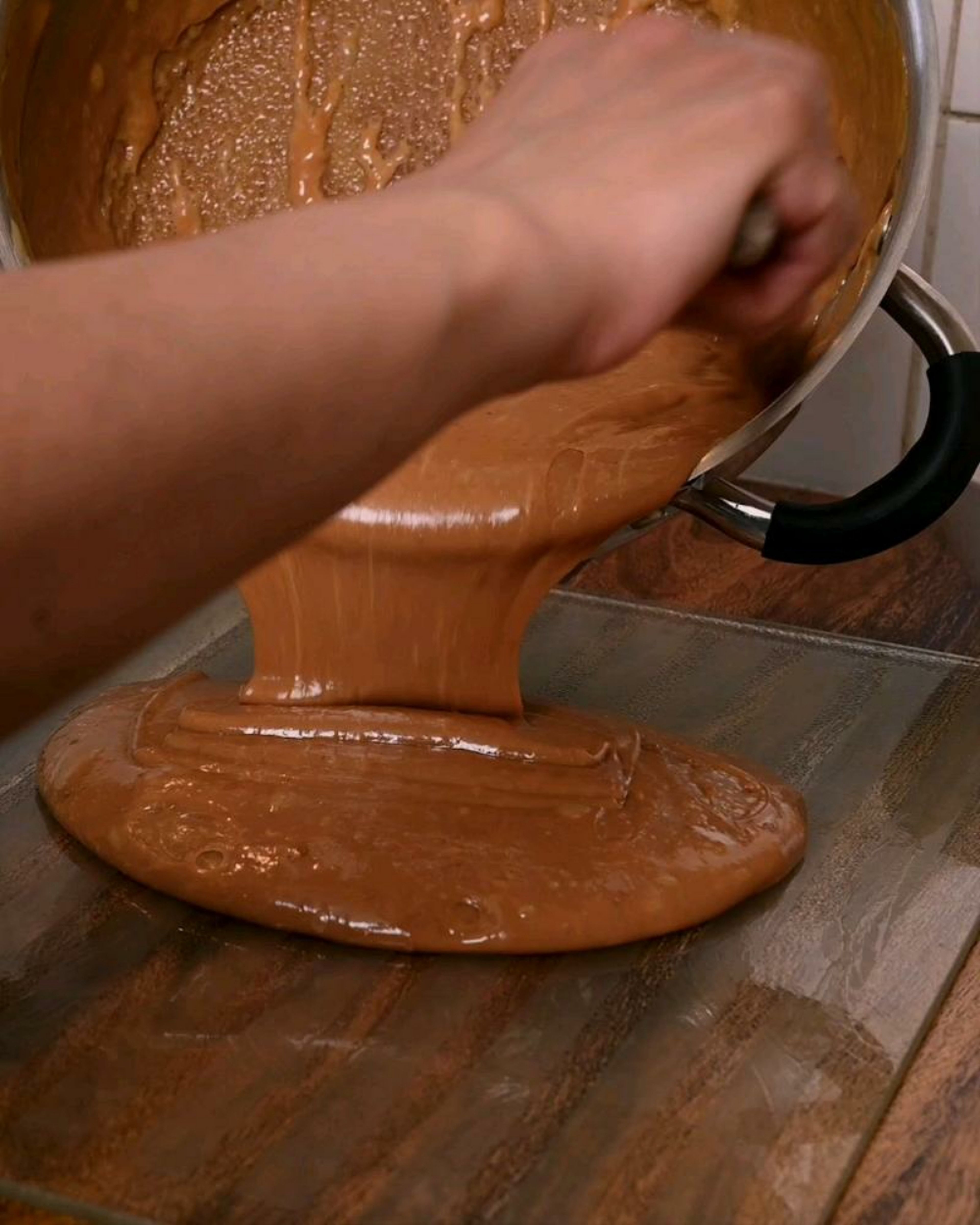 Evenly spread the milk-toffee mixture on the board and let it cool for 5-10 minutes.                                                     *Remember to quickly empty the mixture from the pan, to prevent the mixture from hardening.