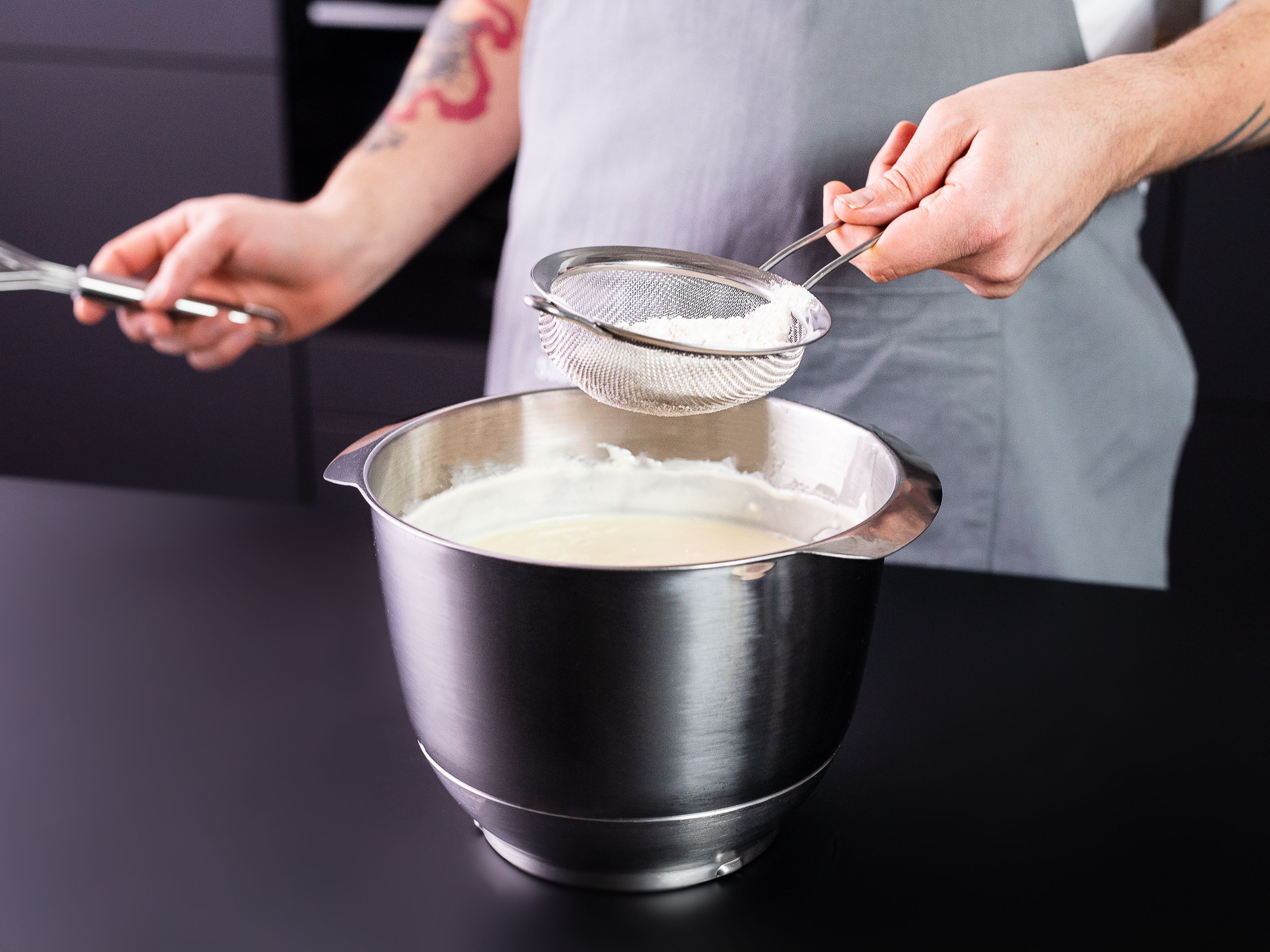 Whip cream cheese and sugar together in a stand mixer with a paddle attachment for approx. 2 min., or until sugar has completely dissolved.