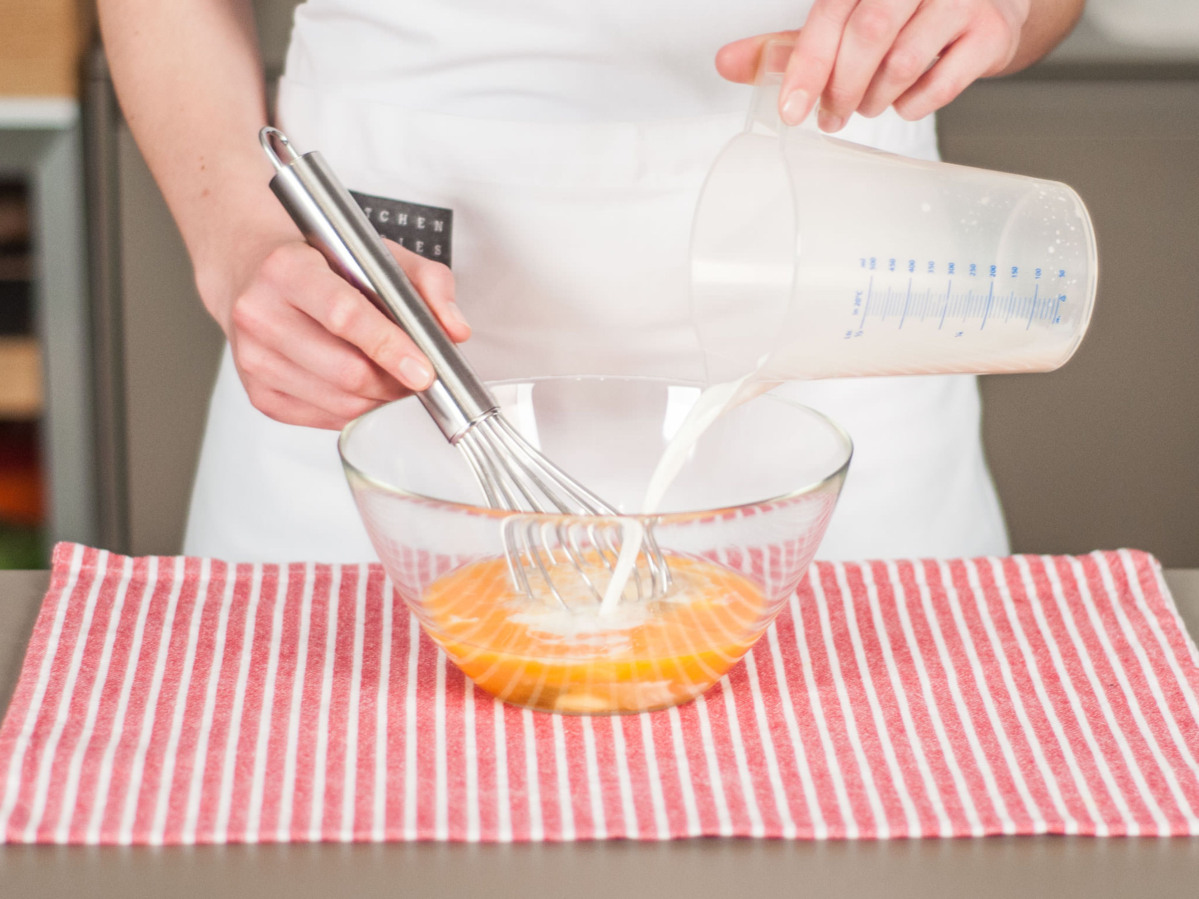 In a large bowl, whisk together eggs and milk.