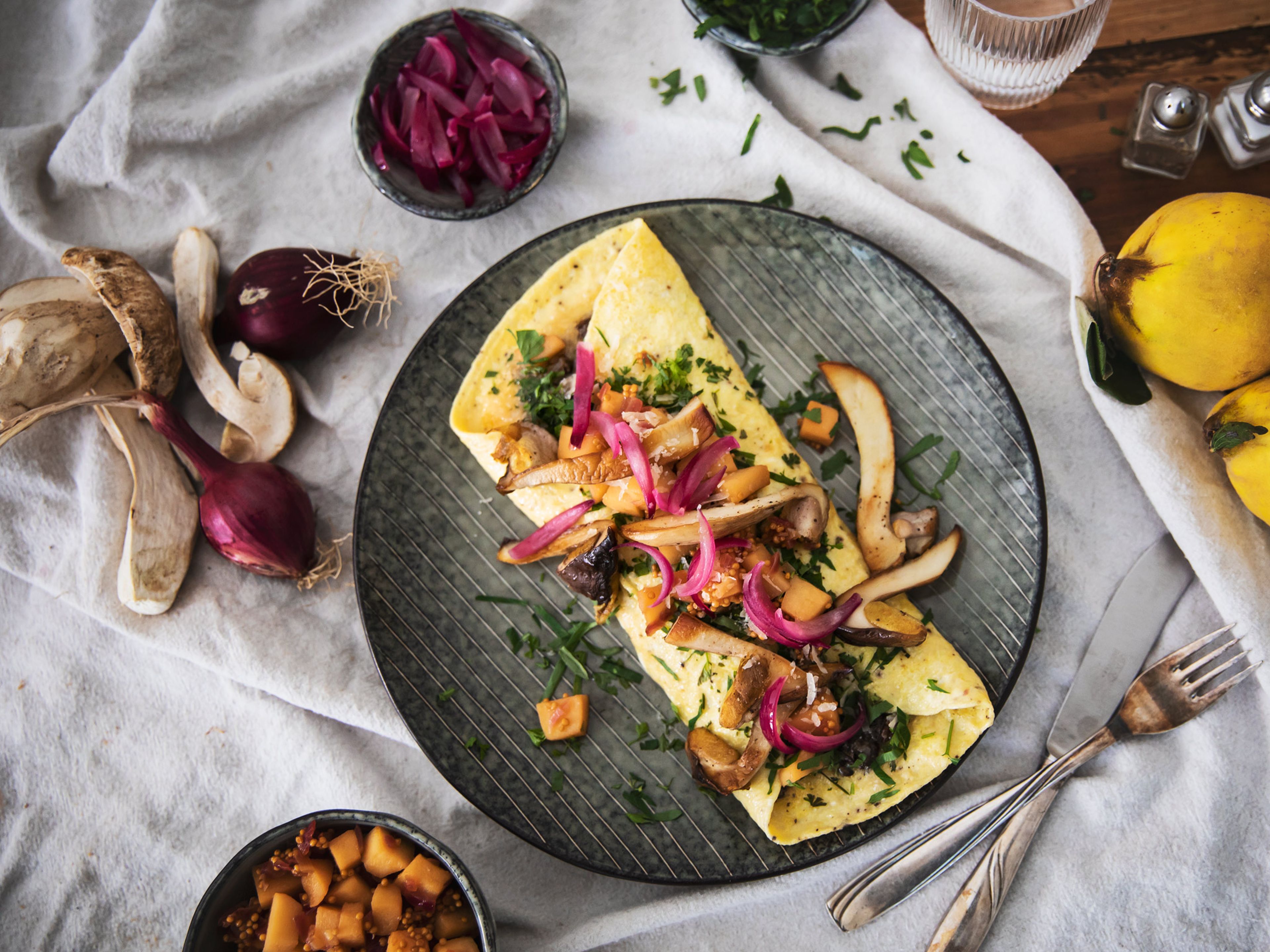 Porcini mushroom omelet with quince relish and pickled red onions