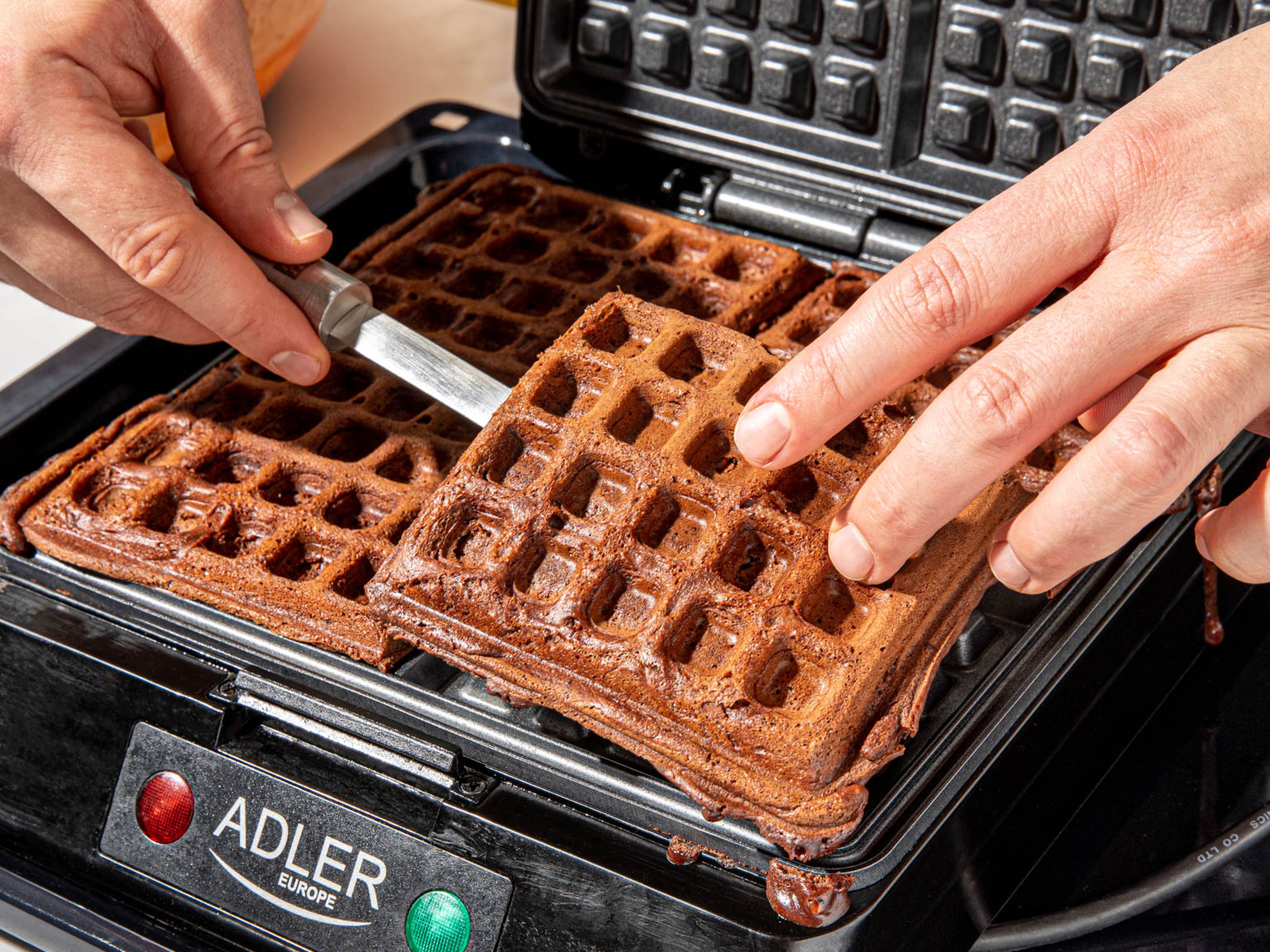 Brush the waffle iron with vegetable oil. Add batter to the heated waffle iron in batches and transfer cooked waffles to a cooling rack. Repeat until all batter is used up.